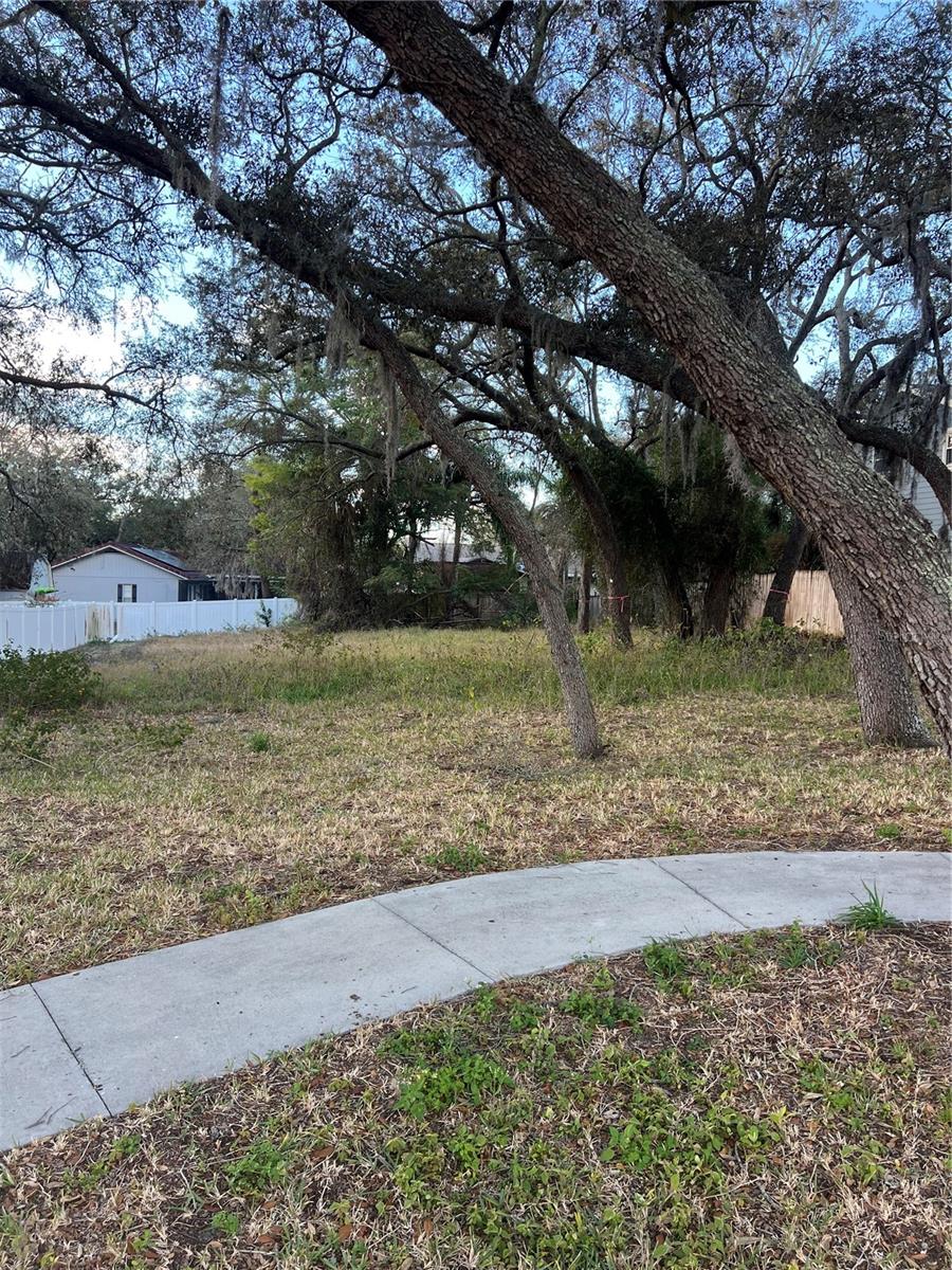 Build your dream home on this 1/4 acre high and dry lot in the Sunset Hills Neighborhood of Tarpon Springs.. This lot is central to all things Tarpon, especially the beaches and A rated schools! Mature landscape, oak trees and a quaint street all add character to this lovely piece of land. This lot is deserving of a custom and supports a home value of 750K-1mm. If you need a home builder thats even better, just ask and we will set you up.