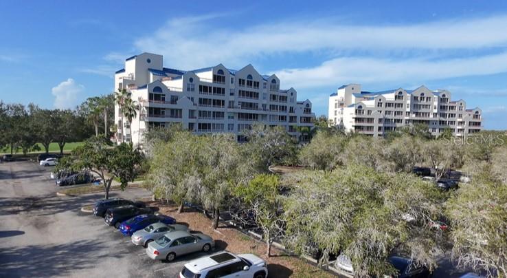 Welcome home to this beautifully maintained 2-bedroom, 2-bath condominium in the sought-after Crystal Bay community of Feather Sound. Perched on the 6th floor, this light-filled residence offers 1,075 square feet of comfortable living space with tranquil views of Tampa Bay and the surrounding ponds.

The open-concept floor plan features luxury vinyl flooring throughout the main living areas, creating a seamless flow from the spacious living and dining room to the updated kitchen. Enjoy modern appliances and recently updated dishwasher, microwave, and stove—perfect for everyday living and entertaining.

The spacious primary suite offers generous closet space and a private en-suite bath, while the second bedroom and full bath provide an ideal setup for guests, a home office, or family. An in-unit laundry room adds everyday convenience.

Step outside to your private balcony and relax while taking in peaceful water views and beautiful Florida sunsets. Additional highlights include a 2023 HVAC system, assigned parking, elevator access, and a secure, well-maintained building.

Crystal Bay residents enjoy resort-style amenities including a heated pool and spa, fitness center, clubhouse, sauna, billiards room, library, and beautifully landscaped grounds. The monthly HOA also covers water, sewer, trash, exterior maintenance, and community amenities, providing truly low-maintenance living.

Ideally located just minutes from I-275, Tampa International Airport, St. Pete-Clearwater International Airport, shopping, dining, golf, and the area's world-famous Gulf beaches, this move-in-ready condo offers the perfect combination of convenience, comfort, and Florida lifestyle.