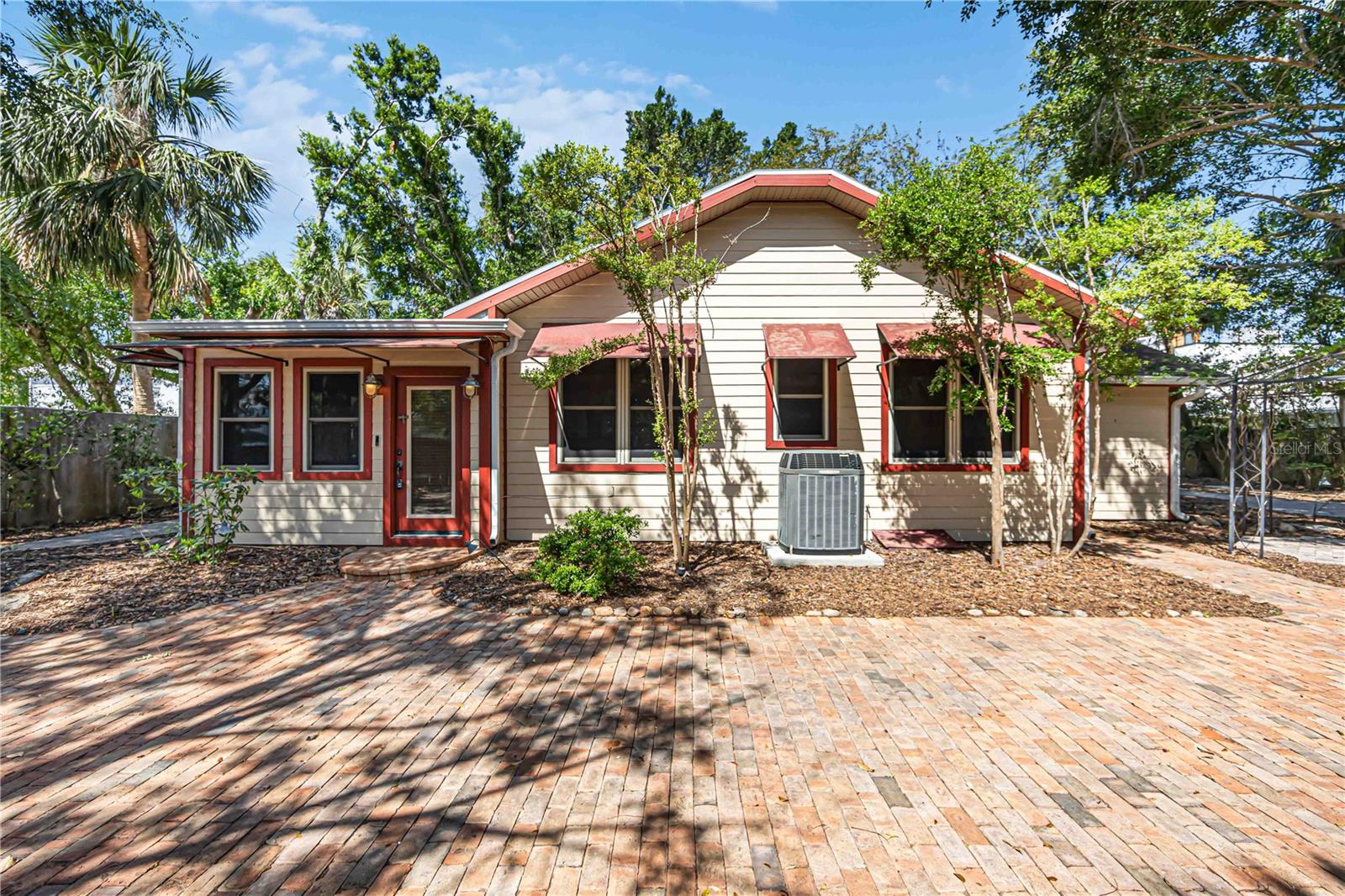 Rare opportunity to own a beautifully restored vintage home with a detached art studio on a 10,000 SF double lot in one of Downtown Sarasota’s most desirable and evolving neighborhoods. Extensively renovated in 2000, the home features updated plumbing, electrical, windows, Hardie board siding, and numerous additional improvements, resulting in an effective year built of 2020. The property blends timeless character with modern functionality while offering exceptional flexibility and value.

Just steps from the 10-acre Gillespie Park, residents enjoy access to tennis and basketball courts, a scenic pond, dog park, fitness trail, playground, and shaded walking paths beneath majestic oak trees. The location is within walking distance of Downtown Sarasota’s restaurants, galleries, shopping, and entertainment venues, and only 0.7 miles from Sarasota Bay and The Bay, the city’s signature waterfront park.

With no HOA, no deed restrictions, DTN (Downtown Neighborhood) zoning, and potential benefits under Florida’s Live Local Act, this property offers unique opportunities for homeowners, investors, and entrepreneurs alike. The detached art studio provides an ideal live-work setting for artists, creatives, remote professionals, or anyone seeking dedicated workspace separate from the main residence.

Enjoy convenient access to Sarasota’s vibrant cultural scene, including the Westcoast Black Theatre Troupe, Sarasota Orchestra, Bayfront Marina, and the city’s renowned arts, dining, and entertainment districts.

Whether you're seeking a primary residence, seasonal retreat, live-work property, or investment opportunity, this home offers a rare combination of historic charm, modern upgrades, generous outdoor space, and an exceptional downtown location.

Adjacent lot also available for purchase. Combined, the properties would create four contiguous lots totaling approximately 19,200 SF (0.44 acres), presenting a rare opportunity for additional space or future development in the heart of Downtown Sarasota.