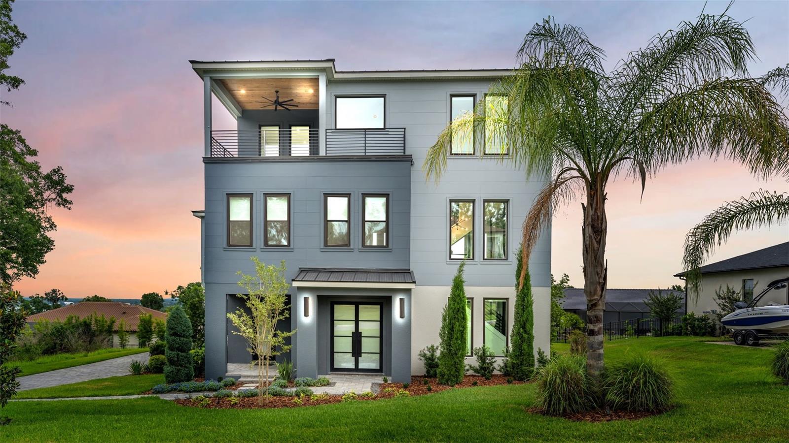 Welcome to The Innovator by Hulbert Homes — a stunning custom-built luxury pool home completed in 2024 and ideally situated within the gated community of Delphi Hills in South Lakeland. Blending exceptional craftsmanship, innovative design, and elevated finishes throughout, this 4-bedroom, 3.5-bath residence offers refined Florida living across three impressive levels connected by a private elevator.

Designed for both everyday comfort and upscale entertaining, the gourmet kitchen is truly the heart of the home, showcasing a striking black ZLINE appliance package including a gas range, built-in convection oven, refrigerator, dishwasher, and designer range hood. Quartz countertops, a massive seating island, custom lighting, tile backsplash, and soft-close wood cabinetry create a sophisticated and functional space. A walk-in “Super Pantry” with built-in shelving and additional quartz countertops adds both elegance and practicality.

The dramatic great room features soaring 22-foot ceilings, an inviting electric fireplace, gorgeous wood flooring, and a stunning wall of sliding glass doors opening to the expansive pavered lanai. Outdoor living is elevated with a gas fireplace, entertaining bar complete with sink and refrigerator, and a screened saltwater pool with waterfall feature and swim-out lounging area designed for resort-style relaxation. A wrought-iron safety fence surrounds the pool area for added peace of mind.

The luxurious primary suite, located on the second level, serves as a private retreat featuring a custom lighted accent wall and spa-inspired bath with split quartz vanities, designer lighting, soaking tub, oversized walk-in shower with multiple shower heads including a rain shower, private water closet, and an unexpected coffee bar complete with sink and refrigerator. The impressive 8x19 walk-in closet offers custom built-in storage and a dedicated makeup area.

The second floor also includes two additional bedrooms, a full bath, and a versatile loft space ideal for a home office, fitness area, media room, or additional lounge space. The third floor is designed for entertaining and unforgettable gatherings, featuring a sprawling 25x28 bonus room complete with wet bar, wine refrigerator, custom wine rack, tile backsplash, and access to a private Trex balcony offering elevated views and additional outdoor living space. In addition, there is a 4th bedroom with wonderful views, a large walk-in closet and a full bath on this level - perfect guest suite, multi-generational living, and more. 

Additional upgrades and features include Magic Glass privacy entry doors, custom shades throughout, double-paned windows, tankless gas water heater, TV mounts in all bedrooms and gathering areas, a beautifully designed powder bath with custom tile flooring, and an oversized, side-entry 3-car garage featuring epoxy flooring, a built-in loft storage area, and a custom Trex staircase.

Delphi Hills offers an intimate collection of luxury custom homes within one of South Lakeland’s most desirable gated communities, conveniently located near shopping, dining, medical facilities, recreational amenities, and top-rated schools. This extraordinary residence seamlessly blends luxury, comfort, and modern sophistication in one unforgettable home.