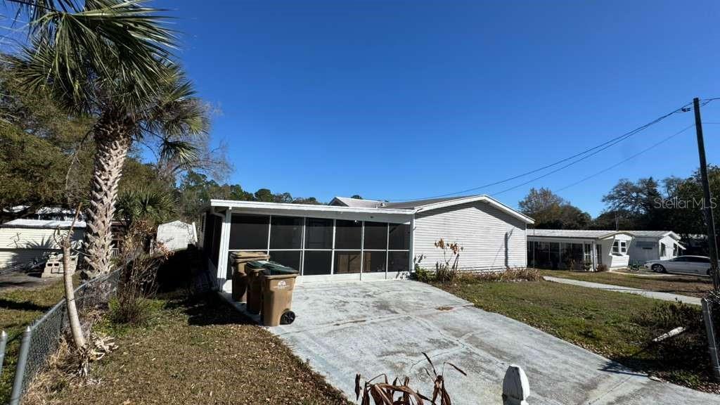 Seller will contribute $5,000 towards buyer's closing costs. Welcome to this charming 3 bedroom, 2 bathroom manufactured home in Eustis, offering peaceful waterfront living with no HOA restrictions. This property sits on a 0.16 acre lot with direct water access and a private boat dock and boathouse, perfect for boating, fishing, and enjoying the Florida lifestyle. The home features an enclosed front porch, providing a comfortable space to relax year-round. Inside, the layout is functional and inviting, ideal for full-time living or a weekend retreat. The backyard opens to the water, creating a serene setting with endless recreational possibilities. With no HOA and private dock access, this is a rare opportunity to own an affordable waterfront property in Eustis.