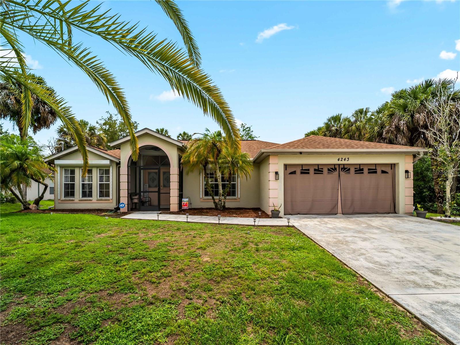 Welcome Home to your piece of Florida Paradise! Move-in ready! This 3-bedroom, 2-bath, 2-car garage, HEATED POOL home with a fully FENCED backyard and CITY WATER is waiting for you. This well-maintained home features new flooring, updated light fixtures, 2020 HVAC & ROOF, ELECTRIC roll-down HURRICANE SHUTTERS, and a 2022 GENERATOR for added convenience and peace of mind. Inside, you’ll find high vaulted ceilings, spacious living areas, and a split-bedroom floor plan ideal for privacy and entertaining. The kitchen features a breakfast bar and all stainless steel appliances. Sliding glass pocket doors off the dining room opens to the spacious L-Shape screened lanai and private heated pool area with direct access from 2nd bathroom creating the perfect indoor-outdoor Florida lifestyle. The large backyard includes a storage shed and offers plenty of room for BBQs, pets, and outdoor activities. NO DEED restrictions, HOA, or CDD fees, NOT IN A FLOOD ZONE. Conveniently located in North Port near shopping, dining, golf courses, entertainment, medical facilities, award-winning Gulf beaches, and the Atlanta Braves Spring Training Stadium. Easy access to I-75 and US-41 makes commuting a breeze. Schedule your private showing today!