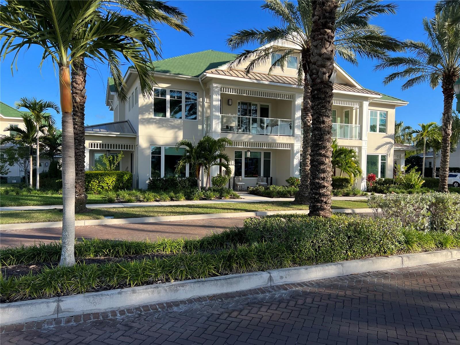 Welcome to the most coveted carriage home at Belleview Place. This is a totally unique home with major luxury finishes. This is the most sought after lot of the community with view of Belleair Country Club West Course, croquet courts, intracoastal water views from multiple rooms, Belleview Inn, and a completely vacant side lot so no neighbor to your West. This carriage home is one of a kind with over 3,300 square feet as well as 3 bedrooms PLUS an expansive office. The primary bedroom is located on the first floor for ease of living. You also have multiple covered patios and balconies for relaxing and entertaining. The owner carefully designed a completely custom interior with several high-end upgrades. The home comes complete with a whole-house generator and gas throughout the home. Your luxury home inside the Belleair Country Club gates awaits you.