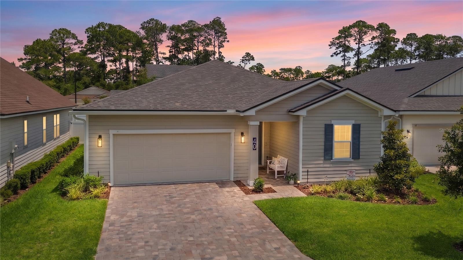 Welcome to your beachside retreat, perfectly positioned just a 5 minute walk from putting your toes in the sand. Located east of A1A, this better than new residence offers the ultimate beach lifestyle with easy access to the shoreline by foot or a short golf cart ride away.

Built in 2023 and loaded with upgrades, this meticulously maintained home combines modern luxury with coastal charm. The open floor plan creates a bright and inviting atmosphere, ideal for both everyday living and entertaining. Inside, wide plank luxury vinyl flooring flows seamlessly throughout the main living areas, complemented by impressive 8 foot doors that enhance the open and airy feel. The interior has been freshly painted throughout, elevating the home well beyond the standard builder grade finish. The gourmet kitchen is a true centerpiece, featuring quartz countertops, abundant workspace, a generous pantry, and custom pull out shelving in most cabinets and drawers, making storage and organization effortless. Whether preparing meals or entertaining guests, this thoughtfully designed kitchen delivers both style and functionality.

The spacious primary suite offers a spa like retreat with a stunning super shower, dual sink vanity, and a dream walk in closet that has been fully customized and beautifully built out. Outside, you'll appreciate the paver driveway, screened lanai, extended paver patio, and fully fenced backyard, perfect for relaxing, entertaining, or enjoying Florida's year round sunshine. The home is equipped with a complete gutter system around the exterior, providing both functionality and added curb appeal. The oversized garage provides space for two vehicles plus additional room for golf cart parking, making it easy to embrace the beachside lifestyle.

Situated high and dry in Flood Zone X, this property requires no flood insurance, providing additional peace of mind. Beyond the home, you'll enjoy an unbeatable location. The renowned Hammock Beach Golf Resort & Spa is just one mile away, offering opportunities for golf and country club membership. Home to the acclaimed Jack Nicklaus designed Ocean Course, this championship 18 hole layout features six holes directly along the Atlantic Ocean, more oceanfront holes than any course in Florida.

Everyday conveniences are close by with Publix just minutes away, local favorites like Bronx House Pizza and Captain's BBQ, and endless outdoor recreation at Bing's Landing, where you'll find a public boat launch, fishing pier, waterfront dining, and access to some of the area's best boating and fishing waters. Nature lovers will also appreciate nearby Washington Oaks Gardens State Park, known for its stunning formal rose gardens, scenic walking trails, kayak launches, and one of Florida's most unique coquina rock shorelines.

When you're ready for a night out, vibrant Flagler Beach is only 15 minutes away, offering beachfront restaurants, bars, boutique shopping, and live music nearly every night. Historic St. Augustine is just 20 minutes north, providing world class dining, cultural attractions, and the charm of America's oldest city.

Whether you're seeking a primary residence, second home, or beachside retreat, this exceptional property delivers luxury, location, and the Florida lifestyle you've been dreaming of.

Please note the following items do not convey: refrigerator, washer, dryer, and jewelry box in master closet.