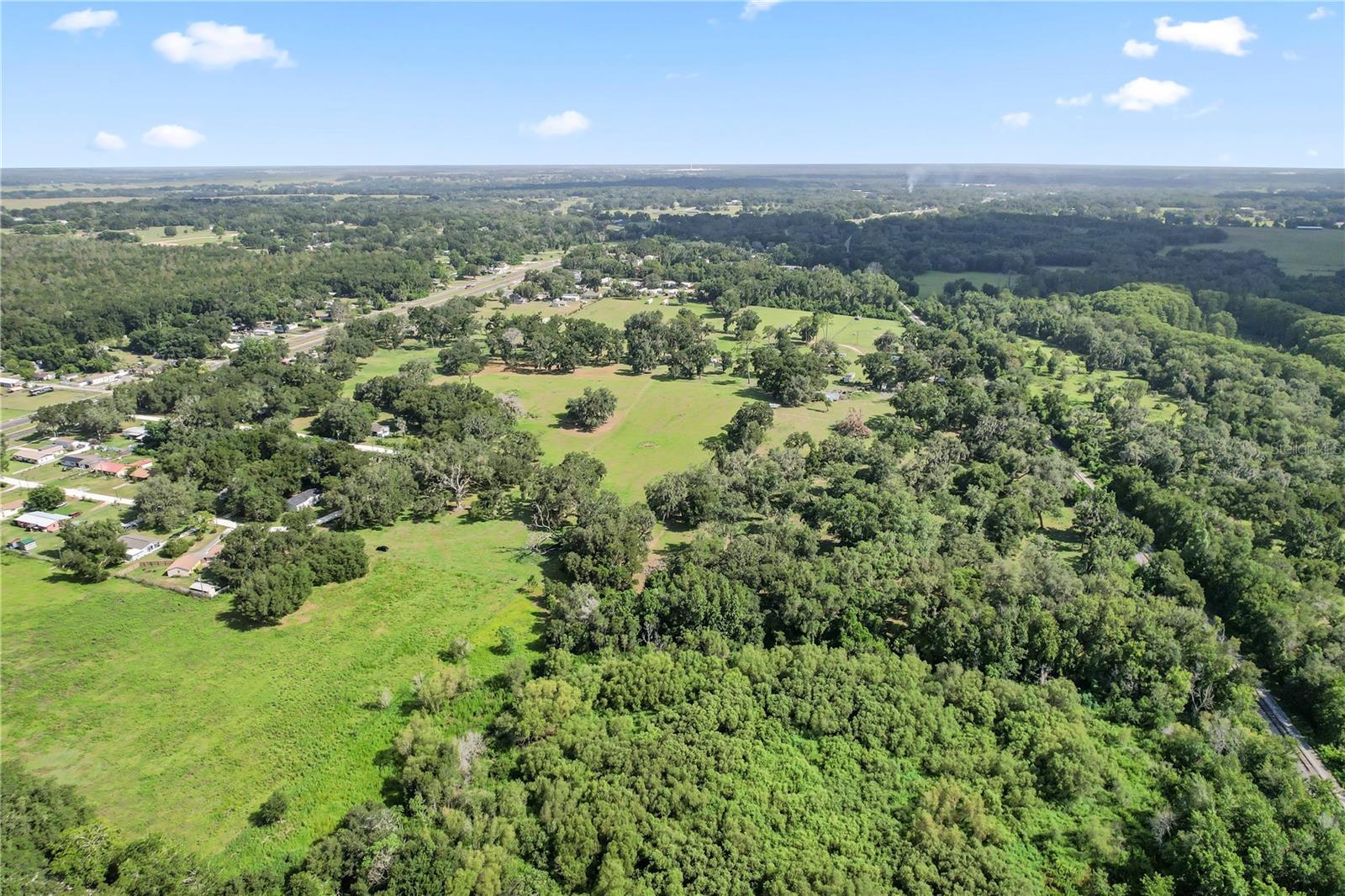 Rare opportunity to own 17.71 acres in Dade City with an existing mobile home, private well, electricity, and exceptional flexibility for a variety of future uses. Whether you’re looking to create a private equestrian estate, family compound, hobby farm, or long-term investment, this property offers the space to bring your vision to life. The existing mobile home provides immediate functionality while you plan for the future. With Future Land Use designated RES-6, the property offers significant future development potential, subject to county approvals and the subdivision process. Enjoy the privacy and peaceful setting of country living while remaining within convenient driving distance of Tampa, Wesley Chapel, and Dade City. Opportunities to own nearly 18 acres with existing utilities and this level of potential are becoming increasingly rare. Buyer and buyer’s agent are responsible for independently verifying all property information, including but not limited to dimensions, acreage, zoning, future land use, development potential, permitted uses, measurements, square footage, and all other facts and features. Mobile home facts and features should be verified by buyers or buyers agents.