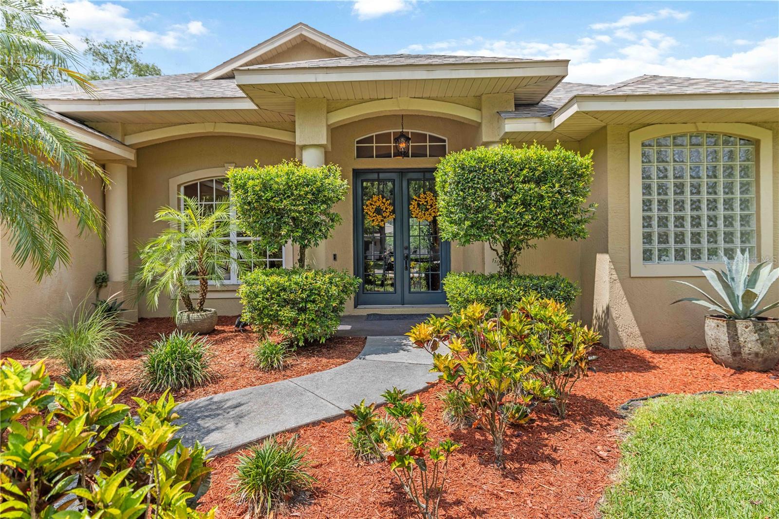 MAJOR PRICE REDUCTION! Now listed at $665,000. Beautifully updated and move-in ready this Eslinger built home has 4 bedrooms, 2.5-baths, double garage home sits on an expansive 0.44-acre lot bordered by mature trees in the highly desirable Mill Creek community. Offering 2,338 sq. ft. of thoughtfully designed living space perfect for both everyday comfort and entertaining. Its prime location provides easy access to dining, shopping, top-rated schools, major roadways, and an easy drive to the world-renowned Gulf beaches. As you enter through the double doors, you’re welcomed by a bright and airy open floor plan, where spacious living and dining areas seamlessly flow into the refreshed kitchen featuring granite countertops with extended seating, a travertine backsplash, undermount sink, rollout cabinet trays, and a new induction cooktop with separate oven (2024). Major updates add exceptional value and peace of mind, including a NEW ROOF (2021), Pebble Tec pool resurfacing (2021), and a rescreened pool enclosure (2021). The inviting outdoor living space is designed for relaxation, complete with a private pool featuring a waterfall, new pool heat pump and variable-speed pump (2025), outdoor TV setup, remotely controlled roller shades, and landscape lighting. A fully fenced yard (2022) offers privacy and flexibility for pets, play, or gardening, while SMART HOME features including irrigation, thermostats, lighting, security, cameras, and garage access make everyday living more convenient. Additional highlights include a built-in coffee bar with wine chiller, Murphy bed, oversized ceiling fans, an insulated garage door with WiFi opener, and wiring for a whole-house generator. For added peace of mind, the seller is also offering a 1-year HOME WARRANTY. Note, NO FLOOD INSURANCE required by lender. Packed with upgrades, this home checks all the boxes. Don’t miss the opportunity to make it yours--schedule your private showing today.