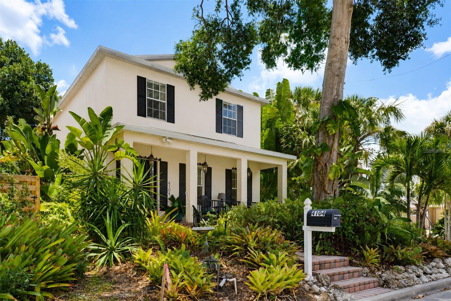 4104 Sarasota Avenue offers a rare opportunity to own a beautifully maintained home in Sapphire Shores, one of Sarasota's most desirable bayfront neighborhoods. Priced at $974,900, this two-story residence combines privacy, character, and an outstanding location with no HOA fees or deed restrictions. Situated on a corner lot with dual street access, the home features 2,270 square feet of living space and more than 3,000 square feet under roof. Built with solid concrete block construction and located in an X Flood Zone, it also benefits from a new roof installed in 2022 and a new AC system installed in 2021. A gated garden entrance leads into a private tropical setting surrounded by mature landscaping. The walled courtyard creates a peaceful retreat complete with a heated swimming pool, hot tub, and plenty of room for outdoor entertaining or relaxing in the Florida sunshine. Inside, 10-foot ceilings and abundant natural light enhance the spacious open floor plan. The living, dining, and kitchen areas flow comfortably together, creating an inviting space for everyday living and entertaining alike. All three bedrooms are located upstairs. The primary suite offers a spa-like bathroom with a soaking tub, generous walk-in closets, and access to a private balcony overlooking the lush tropical surroundings. It's the perfect spot to enjoy your morning coffee or unwind at the end of the day. Additional features include an indoor laundry room, detached two-car garage, covered front porch, and multiple outdoor living areas that make it easy to enjoy Sarasota's year-round lifestyle. The location is hard to beat. Sarasota Bay is just two blocks away, Jungle Gardens is around the corner, Downtown Sarasota is less than five minutes away, and Lido Beach can be reached in approximately twelve minutes. One of the things residents love most about Sapphire Shores is its unique personality. Peacocks freely roam the neighborhood, creating a distinctive charm reminiscent of the famous roaming roosters of Key West. It's a neighborhood that feels both relaxed and vibrant, with a character all its own. For buyers looking to relocate from the Northeast, Midwest, California, or other high-tax states, this home offers an opportunity to enjoy Florida's favorable tax climate while embracing a true coastal lifestyle. Investors will also appreciate the property's location, flexibility, and long-term appeal. Whether you're looking for a full-time residence, seasonal getaway, or investment opportunity, 4104 Sarasota Avenue delivers the location, lifestyle, and value that make Sarasota one of Florida's most sought-after destinations. Welcome to your new home in Sapphire Shores.