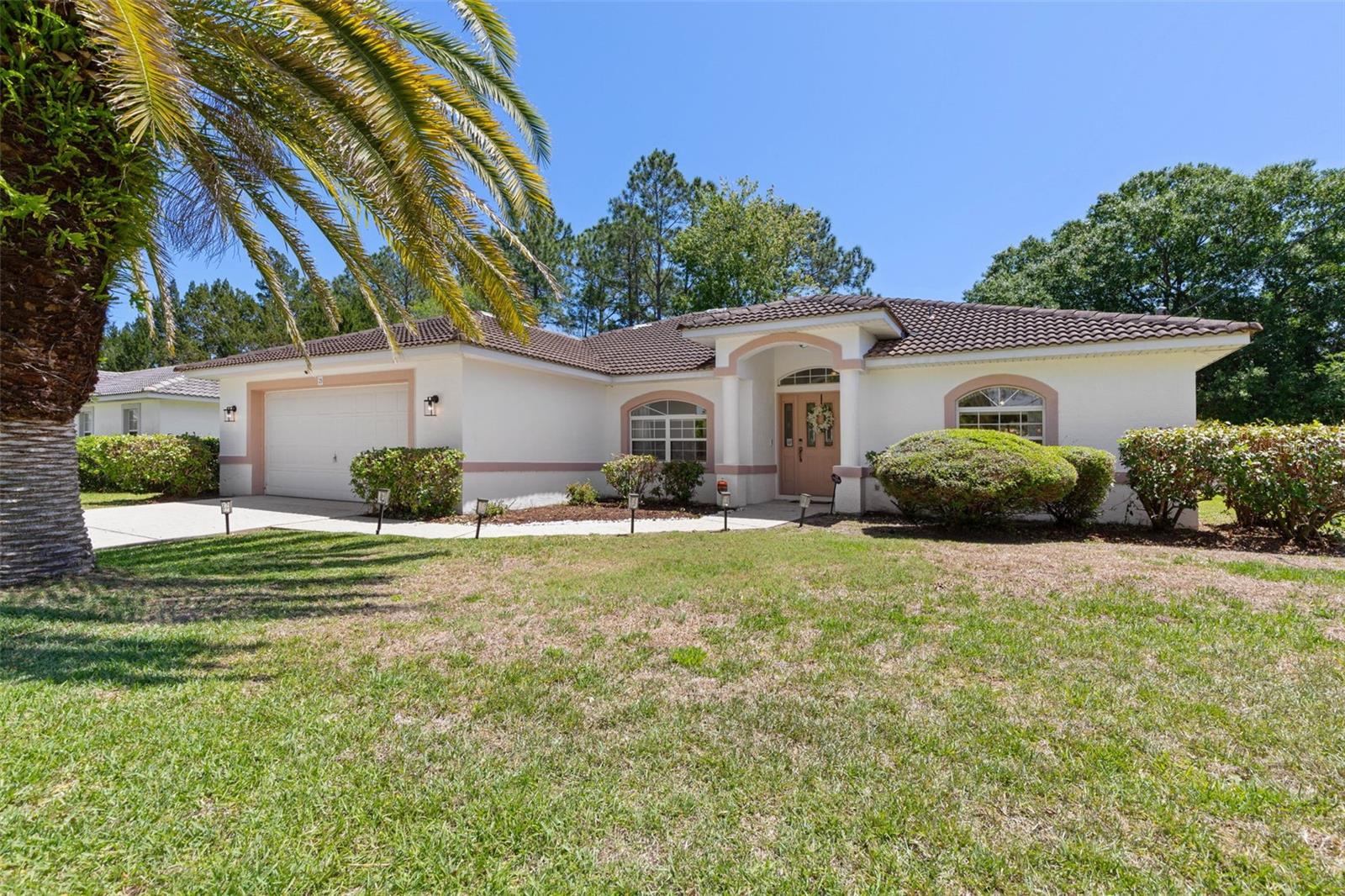 Stop the scroll: Welcome home to this charming 3-bedroom, 2-bath residence in a desirable Palm Coast neighborhood.  Seller has completed a 4-point inspection for your peace of mind.  10 yrs remaining per 4 pt, AC 2016 This home is ready for you to personalize and make it your own! Stepping inside, you are greeted by an airy, open atmosphere highlighted by soaring cathedral ceilings and a neutral palette that serves as the perfect blank canvas. The functional split floor plan offers excellent privacy for the primary suite, while ceiling fans throughout keep the home comfortable and cool. As an added bonus, the home includes two convenient Murphy beds, providing flexible space for guests or a home office. This home is built to last with concrete block and stucco construction, a durable tile roof, and a stamped concrete driveway. A major highlight is the expansive backyard—a vast private oasis with plenty of room to add a pool. Best of all, this property comes with the freedom of no HOA or CDD fees. To ensure a smooth transition, the seller has already had a 4-point inspection completed, providing you with added peace of mind. Per the Report the Roof has 10 yrs of life expectancy remaining. AC is 2016. Located on a peaceful street near paved walking trails and just 7–8 miles from the area's stunning riverfront and oceanfront parks, this home offers an unmatched Florida lifestyle. You are minutes from essential shopping, dining, and medical facilities, with a quick 30-minute drive taking you to the charm of historic St. Augustine or the excitement of Daytona Beach. Whether you are looking for a move-in-ready residence or a smart property with room for your vision, this home is your gateway to the best of Palm Coast. Highlights: 3 bedrooms, 2 bathrooms with a functional split floor plan. Soaring cathedral ceilings and neutral finishes. Includes two versatile Murphy beds. Expansive backyard with room for a private pool. Solid concrete block/stucco construction with a tile roof. No HOA or CDD fees. Conveniently located near beaches, trails, and medical facilities.