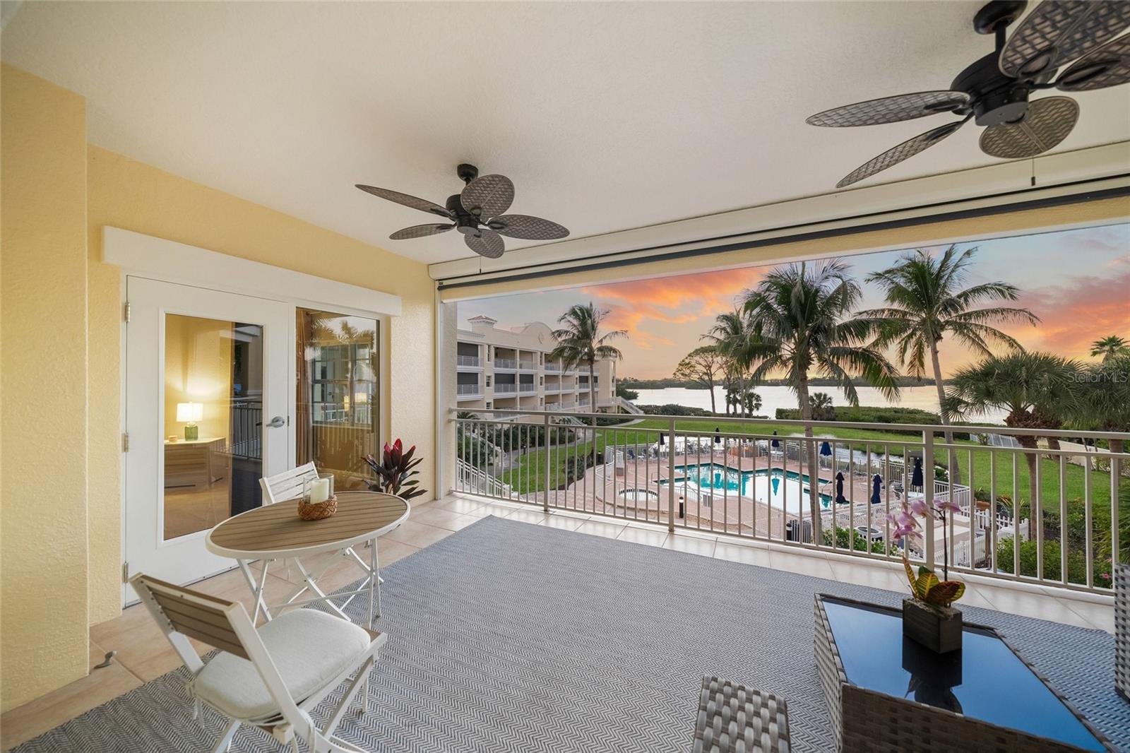 Enjoy breathtaking sunset views overlooking the intercostal waterway in this boater's paradise, complete with an on-site marina. Discover coastal living in this beautifully updated 3-bedroom, 2.5-bath residence located in Bellagio Harbor Village. Ideally positioned between Sarasota Big Pass and the Venice Jetty, and just minutes from Midnight Pass and the Gulf of Mexico, this home offers easy access to pristine beaches, fine dining, and boutique shopping. Walkable to local restaurants and boat docks, the community is both conveniently located and peacefully serene. Offering 2,199 square feet of thoughtfully designed living space, this residence has been enhanced for comfort and style. Updates include new lighting throughout, featuring four coastal ceiling fans and elegant Caprice chandeliers. The spacious primary suite and two additional bedrooms feature new cordless blinds and window treatments, creating private and tranquil retreats. Bathrooms have been refreshed with new toilets, fresh paint, and an updated vanity in the powder room. The well-appointed kitchen showcases shaker-style cabinetry and enjoys stunning Intracoastal and sunset views. Step onto the private lanai and enjoy seamless indoor-outdoor living with direct access to the pool area. Newly installed retractable screens provide shade and privacy when desired while preserving expansive water views. Outdoor enthusiasts will appreciate the on-site kayak storage and launch area, perfect for exploring the surrounding waterways. Located in southwest Osprey, this exceptional residence offers both a beautiful home and a vibrant waterfront community. Residents enjoy access to a resort-style pool, hot tub, sauna, and open-concept gathering spaces—creating a lifestyle where every day feels like a vacation.
