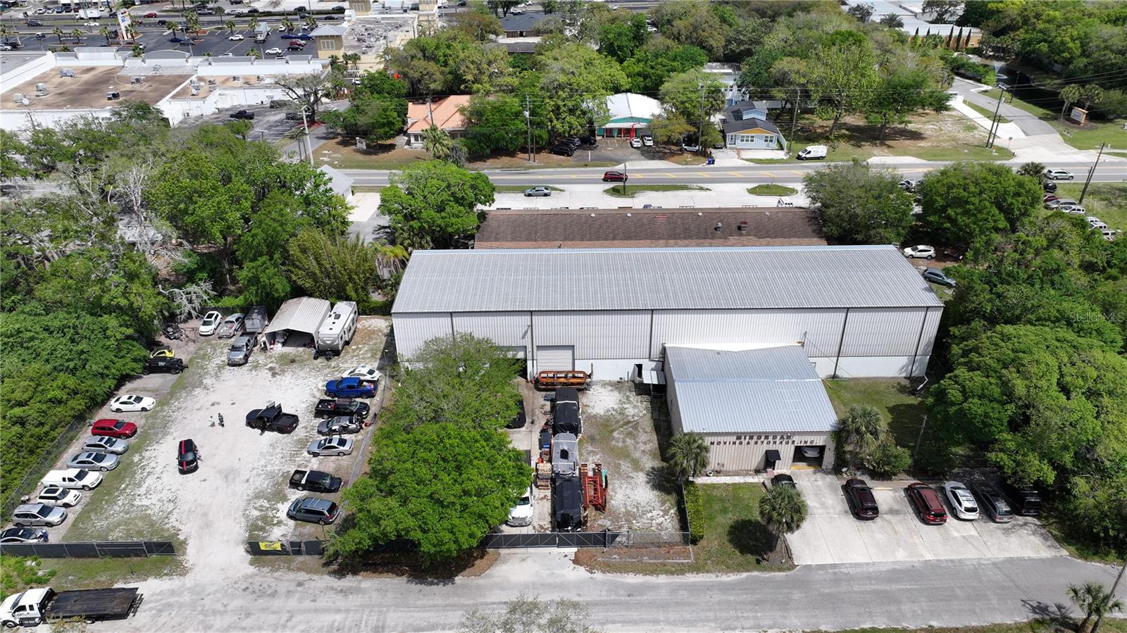 Fully leased 13,436-square-foot warehouse facility, featuring office space and a mezzanine level, along with an additional leased 0.30-acre lot zoned for Industrial Warehouse (IW) use. The warehouse offers an impressive 30-foot ceiling height, providing vertical clearance for storage and operational flexibility. Located within an IW zoning district, the property accommodates a broad range of commercial and industrial uses, making it an excellent investment opportunity.