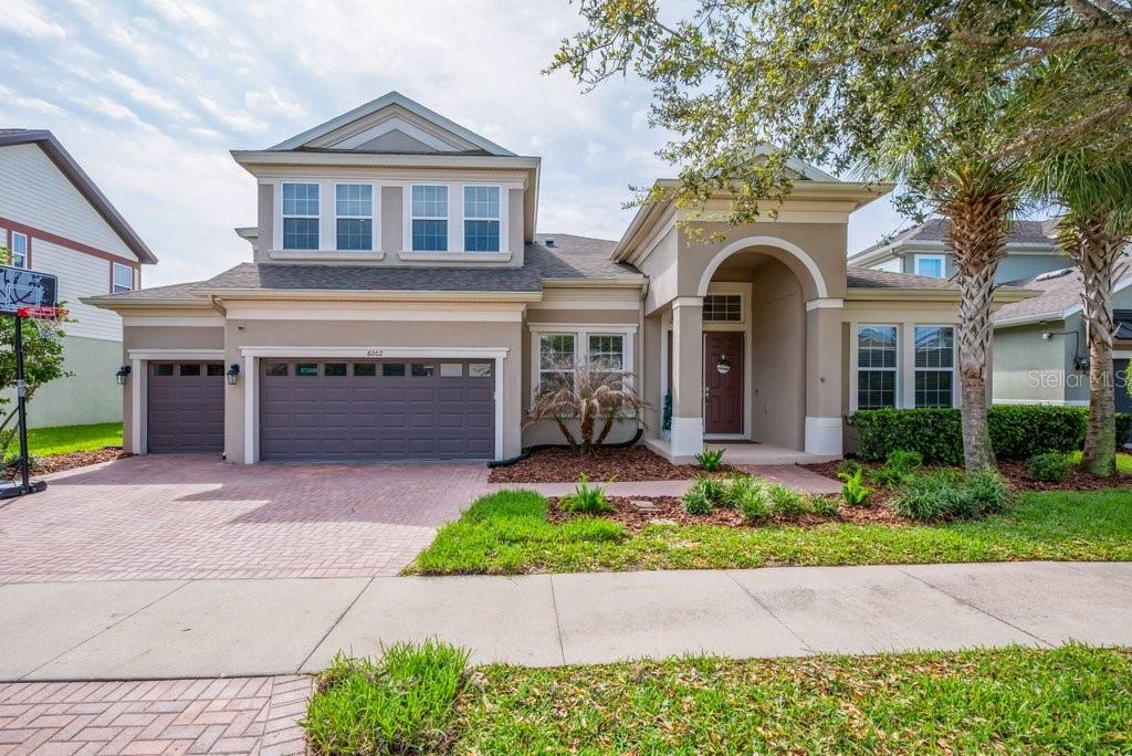 WEST BAY “KEY LARGO II ” MODEL IN FISHHAWK RANCH WEST** GORGEOUS POOL HOME on a ** C O N S E R V A T I O N ** HOMESITE! Designed by distinction, Very Well Appointed and Dressed to Impress! This Popular plan features 5 bedrooms, 4 bathrooms, Den/Study, Bonus Room, and a 3 Car Garage located in the resort style community of FishHawk Ranch West. Come experience this magnificent home on a premium homesite, offering privacy and serene views from nearly every room. Designed with distinction  The open-concept layout is filled with upgrades, including soaring 12-foot ceilings and enhanced flooring throughout the main living areas. A paver driveway and double front doors lead into a welcoming foyer, flanked by a formal dining or living area with crown molding and elegant wainscoting, while a private home office with French doors sits just off the entry. The space opens into a spectacular grand room that seamlessly blends the living, dining, and gourmet kitchen, complete with stainless steel appliances, 42-inch cabinetry, granite countertops, gas cooktop, wall oven, custom lighting, backsplash, and a large island ideal for entertaining. Expansive sliding glass doors extend the living space to a covered and screened outdoor area overlooking the sparkling pool and breathtaking conservation views. The spacious and secluded primary suite offers dual walk-in closets and a luxurious ensuite with dual vanities, a garden tub, and an oversized walk-in shower. The main floor also includes 3 secondary bedrooms, 2 full bathrooms (one serving as a pool bath), and a generous laundry room. Upstairs, you’ll find a versatile bonus room +  the 5th bedroom, and the 4th full bath. Additional upgrades include a whole-home WiFi system, polyaspartic-coated garage floor with overhead storage, and an upgraded pool filtration system. Ideally located within walking distance to top-rated Barrington Middle and Stowers Elementary, and just minutes from Tampa, MacDill AFB, golf courses, and world-class sugar sand beaches, residents also enjoy FishHawk’s award-winning amenities including pools, fitness centers, Central Park, and the Lake House—making it easy to live like you’re on vacation every day.