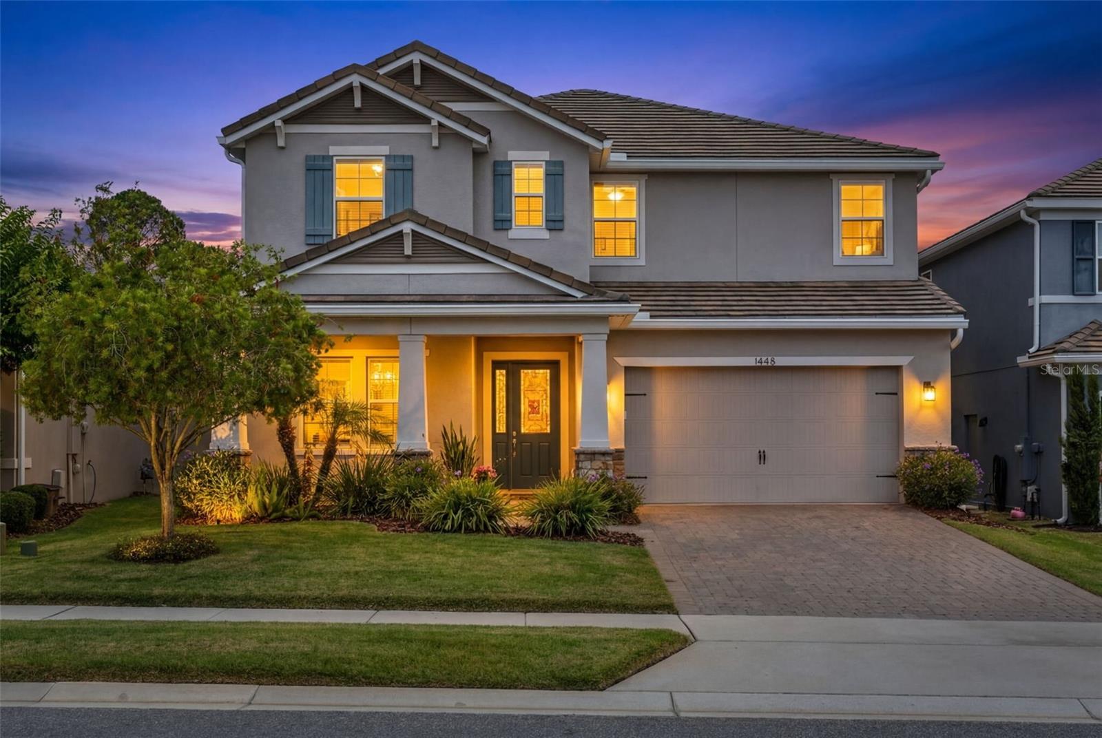 Located within an intimate gated community of just 28 homes and only a short drive to Downtown Winter Park, this exceptional former model home by K. Hovnanian Homes showcases over $200,000 in builder and custom upgrades with luxury finishes and thoughtful design throughout. Residents enjoy access to a private community dock, perfect for launching a canoe or paddleboard or simply relaxing while enjoying sunset views over the water. This stunning Michelson floorplan offers the perfect blend of elegance, comfort, and functionality with spacious living areas designed for both everyday living and entertaining. Upon entry, you’re welcomed by a private office, formal dining room with custom accent features, recessed lighting throughout, beautiful wood-look tile flooring, and designer details at every turn. The open-concept family room features built-in speakers that continue throughout the main living spaces, upstairs, and outdoor lanai area, creating a seamless entertainment experience throughout the home. The gourmet kitchen is beautifully appointed with quartz countertops, 42” cabinetry, stainless steel appliances, gas cooktop, oversized island, modern backsplash, butler’s pantry with wine fridge, and an incredible walk-in pantry with custom built-in shelving. Massive 12-foot triple sliding glass doors open to the resort-style backyard featuring a beautiful open pool, custom fire pit, pergola seating area, pre-wire for a gas grill, and a backyard perfect for relaxing or entertaining. The first floor also includes a guest suite with a full bath and direct pool access, a mudroom, a coat closet, a convenient half bath, and an oversized three-car tandem garage with overhead storage. Upstairs, a beautiful wood tread staircase leads to an expansive loft and bonus room area along with spacious secondary bedrooms, all featuring walk-in closets. A Jack-and-Jill bathroom with dual sinks, additional full bath, oversized linen closets, and a large laundry room with sink and extensive cabinetry provide exceptional functionality and storage. The luxurious owner’s retreat is a true sanctuary featuring tray ceilings, built-in speakers, a stunning accent wall, coffee bar area, spa-inspired bath with an oversized walk-in shower, abundant storage, and an enormous walk-in closet with multiple sections. Additional highlights include a brand-new A/C unit and countless high-end finishes throughout. Ideally located near top-rated schools, shopping, dining, and major roadways, this meticulously maintained home offers elevated Florida living in one of the area’s most desirable gated communities.