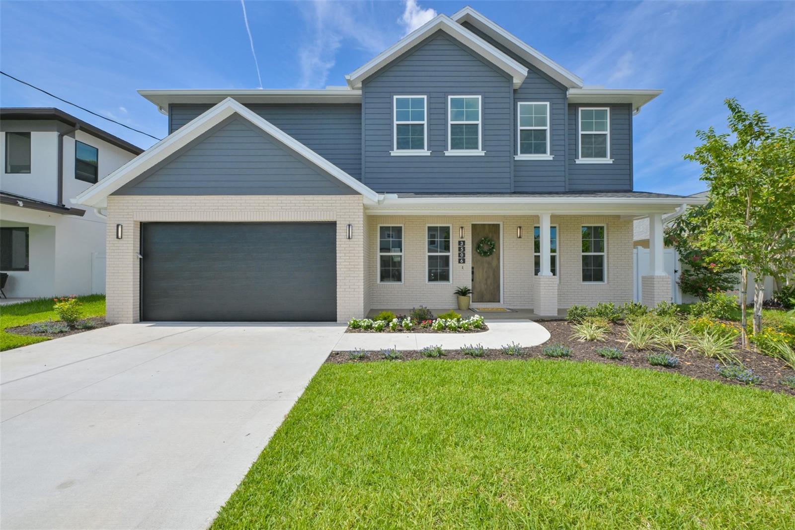 This is another stunning home by a designer known for ensuring that each of her new construction projects has its own distinctive character. Unlike many new homes in the area that feature the same predictable, cookie-cutter aesthetic with white shaker cabinets, this custom-designed residence showcases a bold European modern style. The kitchen combines sophisticated linen-textured upper cabinetry with striking charcoal lower cabinets, while industrial-inspired lighting and a dramatic black brick and black lava rock accent wall in the living room add depth and character to this home. Beautiful quartz countertops run throughout the home, while the large kitchen island stands out as a true centerpiece with waterfall edges and gorgeous Fantasy Brown granite that adds warmth, movement, and style to the space. The open-concept floor plan is centered around a chef-inspired kitchen featuring premium Fisher & Paykel appliances, including an oversized industrial-style refrigerator, induction range, wine refrigerator, and drawer microwave, complemented by a stunning European tile backsplash and a convenient pot filler for both style and functionality. The spacious living room area is anchored by an oversized built-in electric fireplace, creating an inviting space for both entertaining and everyday living. Offering 5 bedrooms, 4.5 bathrooms, a 2-car garage, and 3,196 square feet of thoughtfully designed living space, this two-story residence was built with exceptional attention to quality and detail. Constructed with a concrete block on the first floor and a wood-frame second level finished with durable cement board lap siding, the home is equipped with hurricane-impact low-e windows and doors throughout for added peace of mind. The main level also includes a dedicated office, flexible bonus room, guest suite with a private full bathroom, and large sliding glass doors that open to a spacious covered lanai?perfect for enjoying Florida's indoor-outdoor lifestyle. Upstairs, a versatile loft provides additional living space ideal for a media room, home office, playroom, or lounge. The luxurious primary suite features two walk-in closets and a spa-inspired bathroom complete with a freestanding soaking tub and an oversized walk-in shower. Three additional generously sized bedrooms, two full bathrooms, and a separate laundry room complete the second floor. Additional premium features include 9'4" ceilings, 8-foot interior doors, luxury tile flooring, designer lighting and fixtures, custom landscaping with irrigation, and a built-in wall pest-control system (activation required after closing). Situated on a generous 6,000 sq ft fully fenced lot, the property offers ample room for a pool, outdoor entertaining, or play space. Ideally located in one of South Tampa's most desirable neighborhoods, residents can walk or bike to Ballast Point Park, Bayshore Boulevard, and the Tampa Yacht Club. The home also offers convenient access to the Crosstown Expressway, Gandy Bridge, Downtown Tampa, MacDill Air Force Base, Tampa International Airport, Tampa General Hospital, and the award-winning beaches of St. Petersburg and Clearwater. No flood insurance is required, and there are no HOA fees or deed restrictions. Buyers interested in school options should consult with their agent regarding Florida's school choice scholarship programs, which may significantly offset private school tuition costs for qualifying students.