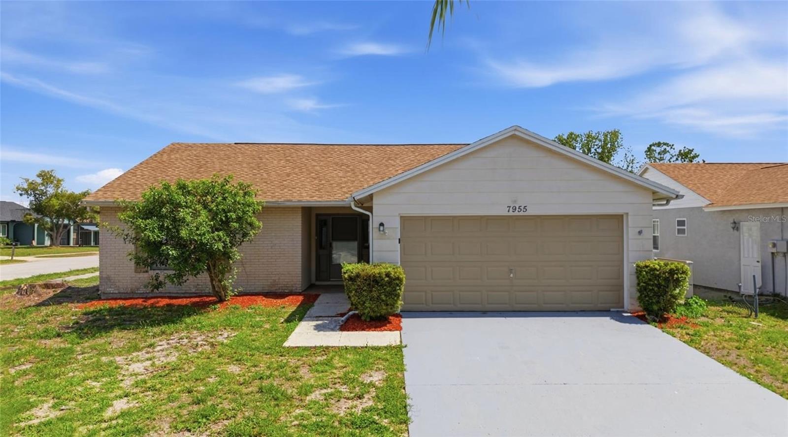 Virtually Staged. Spacious and well-maintained 3-bedroom, 2-bath home situated on a desirable corner lot in New Port Richey. Offering over 1,800 square feet of living space, soaring ceilings, and a functional split-bedroom floor plan, this home combines comfort, flexibility, and everyday convenience.

The open-concept layout features expansive living and dining areas with vaulted ceilings, abundant natural light, tile flooring, and custom built-in shelving and entertainment niches. The kitchen is designed for both daily living and entertaining, offering ample cabinet storage, generous counter space, stainless steel appliances, and a pass-through opening to the main living areas.

The spacious primary suite includes a large walk-in closet and private en-suite bath. Two additional bedrooms are located on the opposite side of the home, providing added privacy for family members or guests. An updated secondary bathroom serves the additional bedrooms.

Step outside to a fully fenced backyard with plenty of space for pets, outdoor entertaining, gardening, or future customization. The covered rear patio is perfect for relaxing and enjoying Florida’s year-round sunshine. Additional highlights include a two-car garage and interior laundry room.

Conveniently located near shopping, dining, schools, parks, golf courses, medical facilities, and major commuter routes, this home offers an excellent opportunity to enjoy comfortable Florida living in an established community.