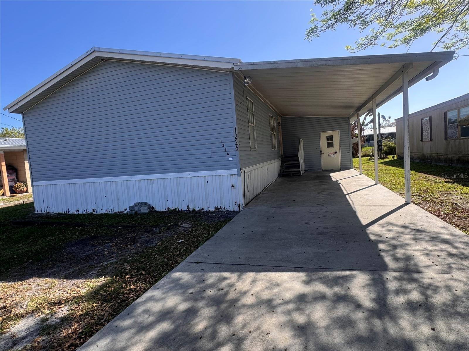 FANTASTIC DEAL ..WE ARE PLEASED TO ANNOUNCE A SIGNIFICANT PRICE ADJUSTMENT.. Offering a more competitive and exceptional monthly payment.  Don't miss the deal. Why rent when you can buy? This 2005 home is move-in ready with over 1,500 square feet. Very spacious 3-bedroom, 2-bath split-plan double-wide mobile home that may be financed through most affordable financing programs. Take advantage of owning a home today and stop paying rent. The home features a large living room, an open floor plan with kitchen and dining areas, and a great laundry room with a side door to the backyard. The yard is suitable for a playground. The main suite is spacious, with a primary bath featuring a walk-in shower and a linen closet. The large front carport is ideal for rainy days. There is an additional utility room for extra storage. Conveniently located near parks, perfect for morning walks. Includes public water service. Close to parks, shopping, and dining. New metal roof in 2023. Schedule A showing today.