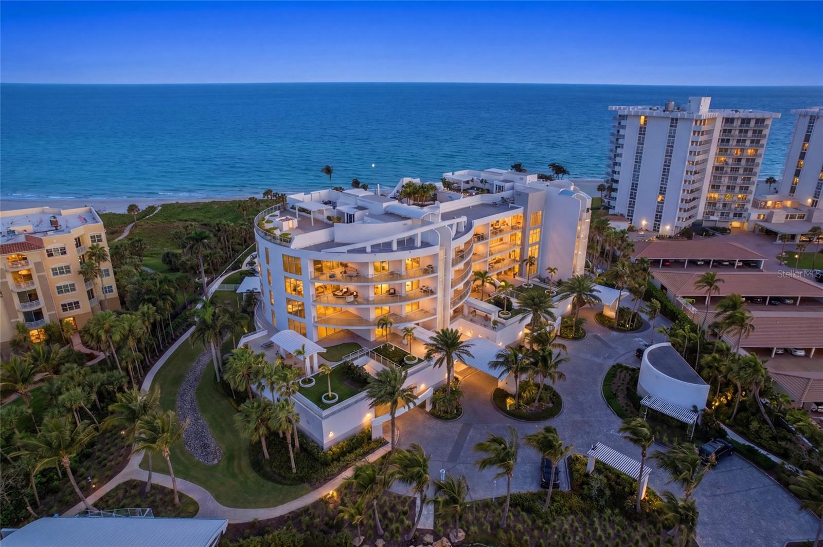 Welcome to an exceptional Gulf-front residence within the prestigious Aria community on the coveted south end of Longboat Key where refined coastal living meets timeless elegance. Set along 300 feet of pristine private shoreline, this extraordinary property offers a rare opportunity to experience true beachfront luxury in one of Sarasota’s most exclusive enclaves.
Beyond the gated entrance, Aria unveils a serene, resort-inspired setting with lush native landscaping, tranquil walking paths, and the historic Villa am Meer, a beautifully restored 1935 seaside mansion that serves as the community’s elegant social centerpiece.
This impeccably designed, residence spans nearly 4,000 square feet and is accessed via a private elevator, opening to a grand foyer and expansive, light-filled interiors. Recent enhancements include freshly painted cabinetry throughout the home. The thoughtfully curated open-concept floor plan seamlessly integrates sophisticated living and dining spaces with a chef’s kitchen, creating an ideal environment for both everyday living and elevated entertaining.
Walls of floor-to-ceiling glass and soaring ceilings invite natural light while framing sweeping, unobstructed views of the Gulf. Expansive wraparound terraces provide the perfect setting to enjoy breathtaking sunsets and coastal breezes from nearly every room.
The gourmet kitchen is a statement of both form and function, featuring premium quartz surfaces, freshly painted custom wood cabinetry, and top-tier appliances by Wolf and Miele. The primary suite serves as a private sanctuary, offering a spa-inspired retreat with dual baths connected by an oversized walk-in shower an exceptional design element rarely found.
Two additional ensuite bedrooms provide luxurious accommodations for guests, while a dedicated office or optional fourth bedroom adds versatility. A bonus room offers additional flexibility for hobbies, media, or storage.
Residents of Aria enjoy an unparalleled suite of amenities, including a beachfront pool and spa, state-of-the-art fitness and yoga studios, massage room, and a private wine cellar. A full-time onsite caretaker ensures a seamless, service-oriented lifestyle. The residence also includes a private, oversized two-car dehumidified garage. Don't miss the NEW video tour.