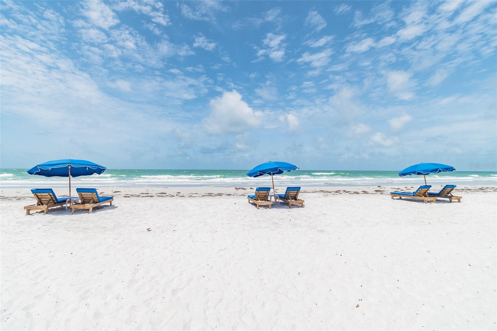 DIRECT BEACH/GULF FRONT - Arguably the prettiest condo in all of the highly-coveted Tides Beach Club and Resort, this amazing unit truly offers the best of coastal living. An open-concept floor plan with neutral finishes, walls of glass capturing wide open vistas of pristine beaches and turquoise blue waters.  Quality of finishes will satisfy even the most selective of buyers.  It is uncommon to find the level of sophistication and quality in similar properties.  The kitchen, which is a culinary delight, comes with a Miele built-in espresso station, Wolf induction cooktop, Subzero refrigerator and separate wine cooler, Miele combo steam/wall ovens and microwave, Kitchen Aid 3 drawer dishwasher, Rohl faucets and white Caesarstone quartz counters and a large center island, all reflecting the ultimate in luxury applications. The master suite offers a private retreat; the master bath has exquisite, detailed tile, a large walk-in shower and separate soaking tub. The additional bedrooms are located on the opposite side of the residence with one having an ensuite bathroom.   Enjoy every aspect of a resort style lifestyle where sunsets are amazing and the beaches are pristine along this ¼ mile stretch that only the Tides offers. Attractive finishes such as shiplap wall treatments, exquisite LED lights, remote privacy blinds, electric hurricane shutters, customized closets, and newer sliders and windows are just a few of the added improvements that detail this fine property. The Tides is a pet friendly community (2 pets up to 35 lbs.) Located in the residential Sereno building where the condos offer additional privacy and spaciousness, owners enjoy their private swimming pool, hot tub, and cooking grill. Additional amenities on the grounds of the community include a club house, gym with fitness equipment, recreation and meeting areas and much more.  This is a gated community.
