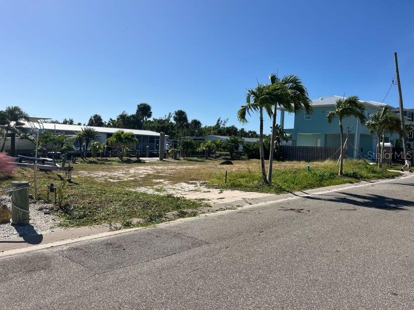 The Ultimate Boater's Foundation!

Rare Canal-Front Lot with Twin Lifts & New Seawall! This prime, cleared canal-front lot offers the most turn-key building opportunity on Longboat Key. While other buyers are stuck in the permitting phase for marine infrastructure, this one already has it complete and you can dock your fleet on day one.

Unmatched Infrastructure Value:
• Brand New Seawall: 100 feet of reinforced concrete seawall installed in 2022, providing maximum protection and a pristine aesthetic.
• Dual High-Capacity Lifts: Professionally installed in 2023, featuring a 13,000 lb lift for your primary vessel and a 10,000 lb lift for a secondary boat, skiff, or jet skis.
• Deep Water Access: Located on a wide, clean canal with direct access to Sarasota Bay and the Gulf of Mexico—perfect for serious anglers and weekend cruisers alike.

The Lifestyle:
Located in a quiet, "Old Florida" neighborhood on the north end of the island, you are just a minutes from deeded GULF beach access. After a day on the water, walk to the island’s best restaurants or enjoy the sunset from your private 100-foot waterfront.

Investment Specs:
• Price: $799,000
• Lot Size: 0.15 Acres (Cleared and Buildable)
• Utilities: Public water/sewer connected and ready for hookup.

Bonus: Deeded beach access included.

Why buy a tear-down when you can start fresh on a lot that already has $150k+ in modern marine upgrades? Bring your builder and your boats.