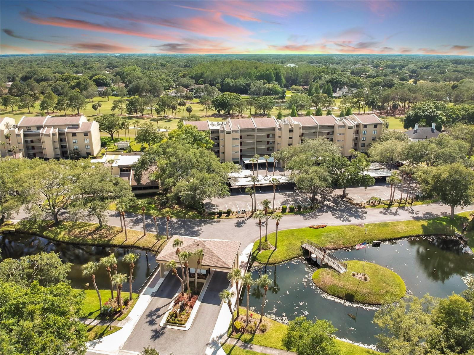 Some photos have been virtually staged.Welcome to Greenfield Midrises in desirable Carrollwood Village! As you enter this beautifully maintained condo, you'll be greeted by stunning golf course views. This spacious unit features new laminate flooring, fresh interior paint, a large kitchen with plenty of storage, and a hands-free faucet in the primary bathroom.

The enclosed balcony adds valuable living space and provides the perfect place to relax and enjoy the view. Your private laundry room is conveniently located just outside the unit, and the building offers two elevators plus stairwell access just steps away.

Enjoy maintenance-free living in a well-maintained community with a pool, clubhouse, and convenient access to shopping, dining, parks, and major roadways.  And if you are a golfer, the Carrollwood Country Club and golf is just steps away!!!