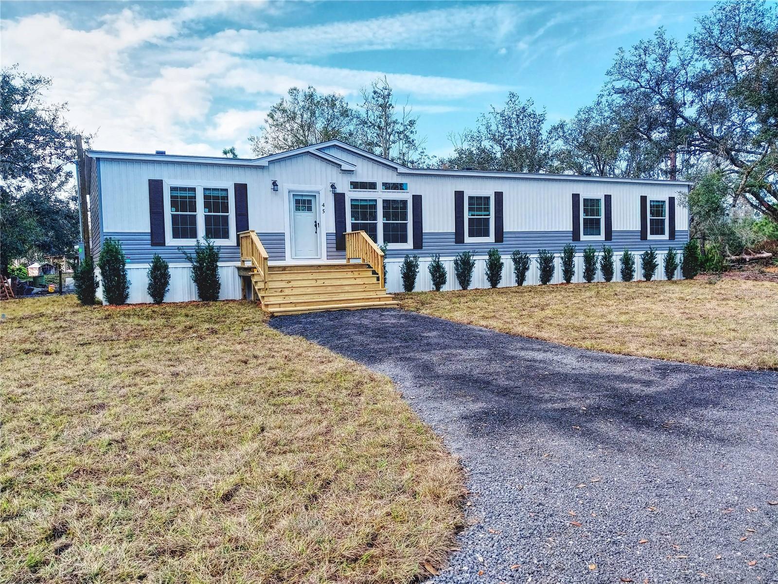 Motivated seller and is willing to consider all offers. Embrace the pinnacle of modern country living with this brand-new 2025 manufactured home, perfectly situated on 3.58 private acres just outside the city limits of Frostproof. Ideally located in the center of the state, this expansive four-bedroom, three-bathroom residence offers the ultimate retreat, combining contemporary design with the peace and freedom of the Florida countryside.  The heart of the home features soaring 9-foot ceilings that enhance the open-concept feel of the chef-inspired kitchen. This culinary space comes equipped with 2025 stainless steel appliances, an abundance of cabinet storage, and a dedicated coffee bar for your morning ritual. Guests can gather around the large breakfast bar or enjoy formal meals in the adjacent dining room. Designed for versatility, the floor plan boasts both a formal living room and a cozy family room, ensuring plenty of space for entertaining. Retreat to the private primary suite, a true sanctuary featuring a massive walk-in closet and a spa-like ensuite with dual sinks, a walk-in shower, and a deep soaking tub. The split-bedroom layout ensures maximum privacy, while the convenient indoor laundry room adds modern functionality to your daily routine. Outside, the possibilities are endless. With over three and a half acres of land, you have the freedom to create your own homestead, workshop, or garden oasis. While you’ll feel worlds away from the hustle and bustle, your central location ensures you are perfectly positioned for adventure, located approximately 90 minutes from the vibrant attractions and international airports of both Tampa and Orlando. Experience the best of Florida’s rural charm in a never-lived-in masterpiece— bring all your offers and make this dream home a reality. Schedule your tour of this 2025 Frostproof gem today!