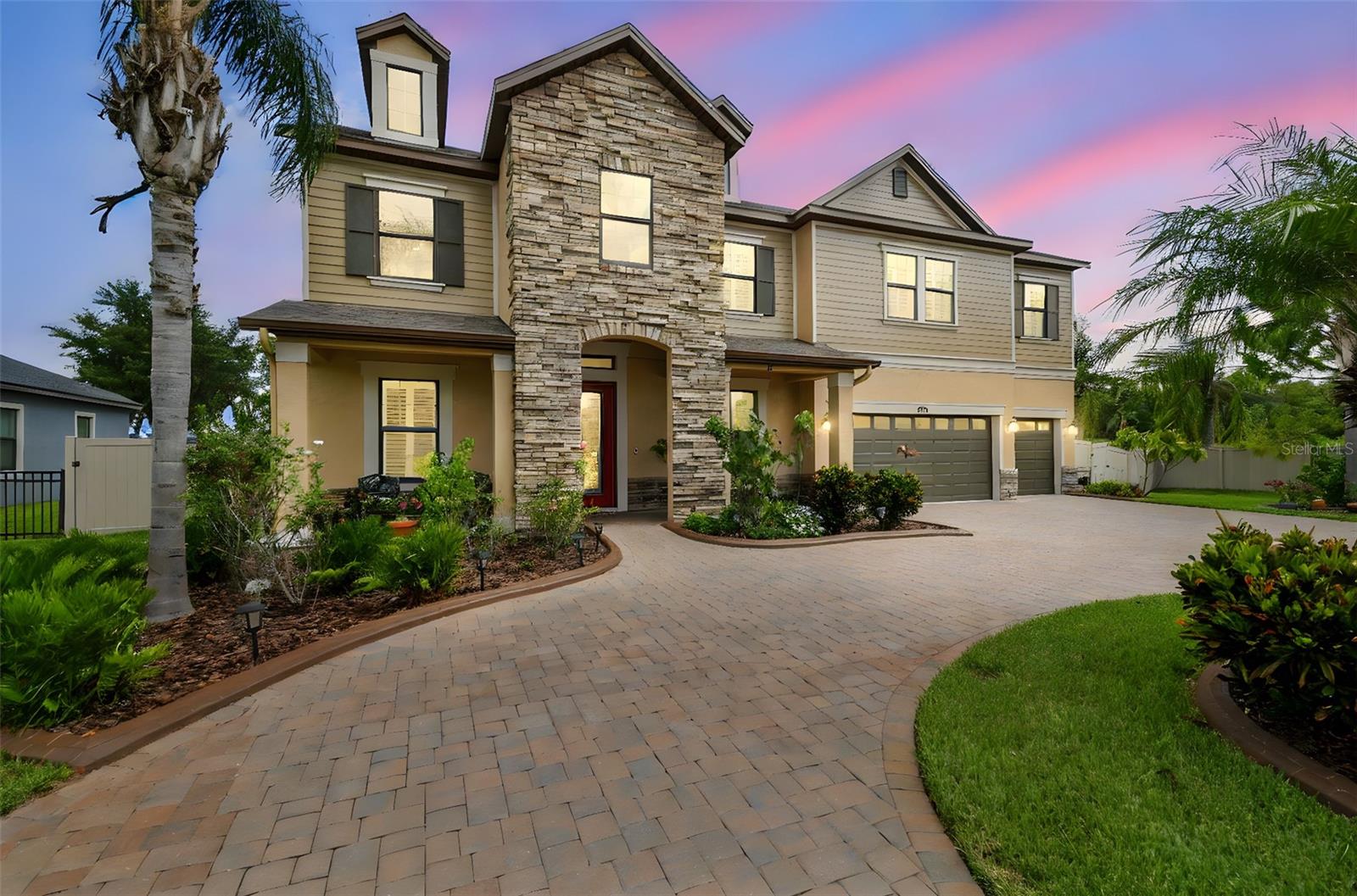 Conveniently Located Lakefront Estate | 5 Bedrooms | 5.5 Bathrooms | 4,200+ Sq Ft | 3-car Garage

Enjoy convenience and tranquility! Ideally located near I-75 and the Suncoast Parkway, this home offers easy access to the Premium Outlet Mall, exceptional dining, entertainment, and endless recreation — all while providing a peaceful place to unwind at the end of the day. Set along the shores of 200-acre Lake Padgett, a most exclusive and coveted ski lake, this custom-built lakefront estate offers timeless elegance, modern comfort, and resort-style living. Positioned on a beautiful XL homesite, the residence delivers privacy, and breathtaking waterfront views.
Spanning more than 4,200 square feet, the home features five bedrooms and five and a half baths, designed to accommodate both intimate daily living and grand-scale entertaining. Included with the property is a private floating dock—providing immediate access to boating, paddleboarding, fishing, and sunset cruises directly from your backyard.
The interior is defined by soaring ceilings, expansive windows, and an elegant formal living and dining area that captures sweeping lake views. At the heart of the home, the open-concept kitchen and family room flow seamlessly to the dramatic two-story screened lanai, overlooking the gas-heated pool and spa and the tranquil waters beyond. This effortless indoor-outdoor connection creates an atmosphere perfectly suited for refined entertaining and elevated everyday living.
The main level offers exceptional convenience with a private in-law or guest suite featuring its own en-suite bath with a large walk-in shower, complemented by a separate full pool bath and an additional half bath for guests when visiting.
Upstairs, a spacious loft provides a flexible retreat for media, recreation, or relaxed gatherings. The primary suite serves as a serene sanctuary, complete with dual walk-in closets and a spa-inspired bathroom featuring a soaking tub, dual vanities, . From the suite, step onto the full-width upper balcony to enjoy unobstructed views of the pool, lush grounds, and shimmering lake—an ideal backdrop for morning coffee or evening unwinding.
Additional upstairs accommodations include an expansive double-sized bedroom with an oversized walk-in closet, and two generously proportioned bedrooms with a Jack-and-Jill bathroom.
Designed with both luxury and functionality in mind, the home includes pre-wired surround sound, a pre-plumbed water softener loop, abundant garage storage, and a full two-story screened enclosure that enhances year-round outdoor living. The resort-inspired grounds feature an expansive pool deck, a built-in fire pit, a fully fenced backyard, and an irrigation system supplied by well water.
There is also a paved circular driveway, five overhead garage storage racks, and direct lake access via a shared dock with only one neighboring residence, all within a private gated enclave. This is a rare opportunity to own a true lakefront estate where every detail has been curated to deliver an elevated lifestyle defined by elegance, privacy, and natural beauty.

HOA Fees include all common ground maintenance and sprinkler repairs, gate phone line and maintenance, well, ALL LAWN watering, boat and/or trailer storage (a savings of $150+ per month), lake/pond maintenance, common ground fertilizing, and reserves.

This Lake Padgett estate invites you to experience waterfront living at its finest.