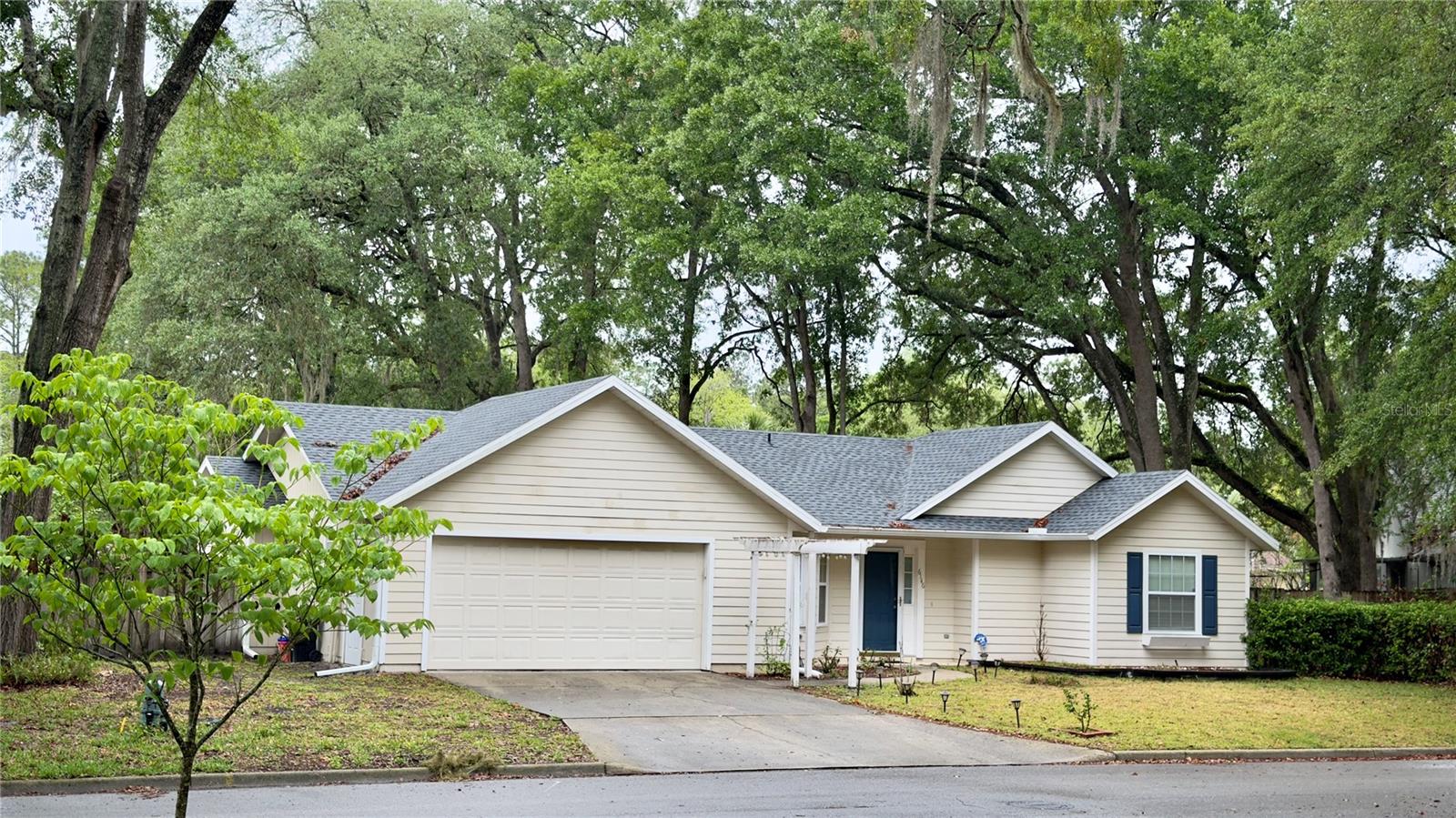 This charming three-bedroom, two-bath home in the highly sought-after Millhopper Station community is truly move-in ready. Notable upgrades include newer windows, a 2025 roof, a 2026 water heater, a 2019 A/C system, updated bathroom tile, and modern vanities. Upon entering, you’ll find a spacious open great room and a bright kitchen that flows seamlessly into the dining area. The home features granite countertops, stainless steel appliances, and wood flooring throughout. The primary suite offers a walk-in closet and a private ensuite bathroom. A screened-in porch provides the perfect spot to enjoy your morning coffee before stepping into the beautifully landscaped backyard, complete with a well-sized storage shed discreetly tucked to the side. Conveniently located to Talbot Elementary School, three nearby parks, and close to Starbucks, shopping, and dining. Schedule your tour today!