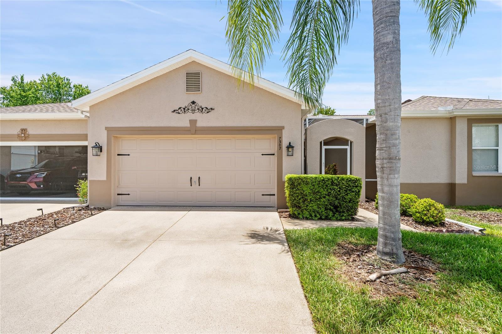 WOW AND WOW.  MOVE IN READY.  A GORGEOUS 2BED/2BATH 2-CAR GARAGE VILLA OVERLOOKING THE MOST BEAUTIFUL CONSERVATION LOT FROM THE SCREENED AND ROOFED LANAI.  THIS HOME IS WARM AND INVITING with upgraded floors in all the rooms, beautiful fans and light fixtures.  Kitchen has stainless steel appliances, laundry room has washer and dryer and storage. The split bedroom floor plan provides ideal privacy for guests.  Plantation shutters on all windows.  WATER HEATER NEW, 2024  NEW ROOF, NEW PAINT OUTSIDE, A/C 2023. TUB LIGHT IN LIVING ROOM MAKES THIS HOME LIGHT AND BRIGHT. The Groves is an active adult golf course gated community. HOA COVERS LAWN CARE, PAINT OUT SIDE, ROOF REPLACEMENT, CABLE AND INTERNET.  RIGHT OUTSIDE THE GATES IS A PUBLIX SHOPPING CENTER.  THE GROVES OFFERS A CLUBHOUSE WITH LIBRARY, WORKOUT ROOM, CRAFT ROOM, RESTAURANT AND BAR, AND MEDIA ROOM.  OUTSIDE IS A HEATED SALT WATER POOL AND SPA, PICKLEBALL, TENNIS COURTS, BOCCE, SHUFFLEBOARD, 18-HOLE GOLF COURSE WITH PRO SHOP.  PLEASE COME AND VISIT THIS BEAUTIFUL HOME TODAY.