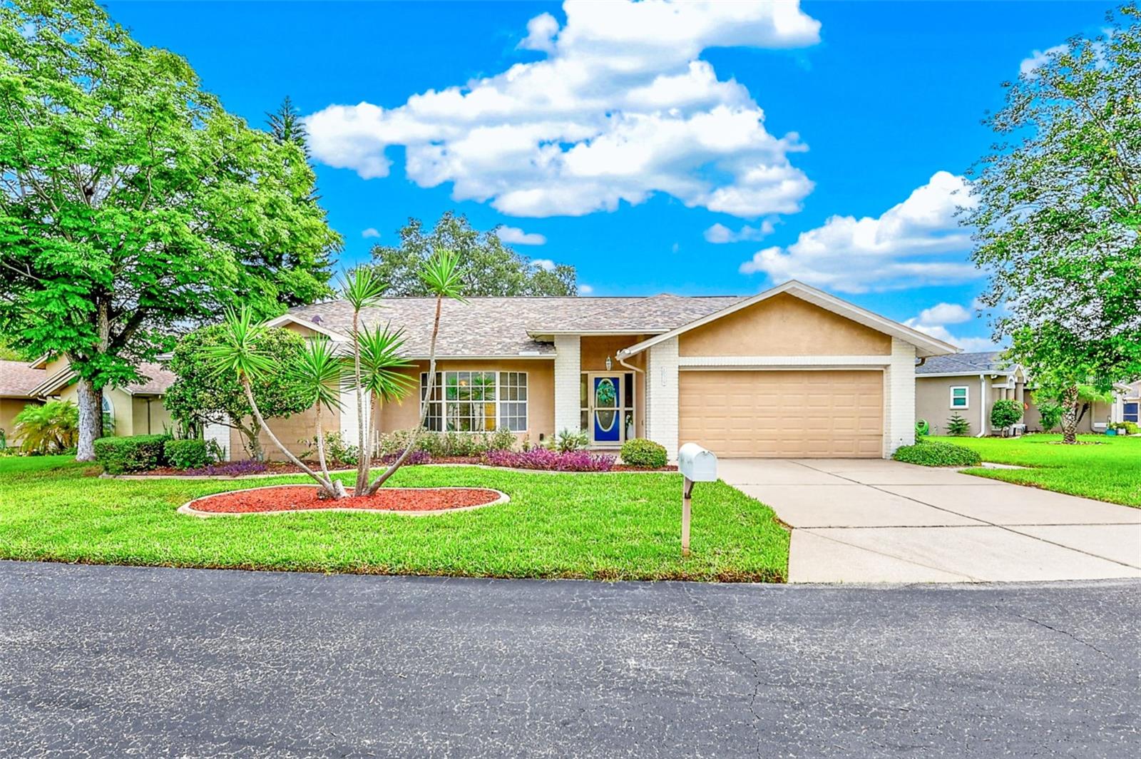 Welcome to this charming 3-bedroom, 2-bath, 2-car garage salt water pool home offering comfort, functionality, and inviting living spaces throughout. This well-maintained residence features a desirable layout with plenty of room for everyday living, entertaining, and creating lasting memories. Step inside through a beautiful foyer featuring a convenient coat closet, creating a warm welcome for family and guests. The spacious living room is filled with natural light from large windows, providing the perfect place to relax, unwind, or entertain. The separate dining room offers an ideal setting for family meals, holiday gatherings, and special occasions. The galley-style kitchen provides an efficient layout making meal preparation a breeze. it also has a breakfast nook located at one end with two large windows.  A perfect place to eat meals while viewing the pool.  Off the kitchen is a comfortable family room perfect for entertaining and relaxing. The home offers comfortable bedrooms with plenty of space for family members or guests, while the two bathrooms provide convenience and functionality.  The master bedroom is large with a luxurious master bathroom, which includes a walk in shower, his and hers sinks, and a tub with shower.  The hall bathroom can also function as a pool bathroom. Step outside to your own private backyard retreat featuring an inground saltwater pool with a spa—perfect for cooling off on warm days, relaxing after a long day, or hosting friends and family. The large covered patio creates a peaceful setting for entertaining, enjoying the sunshine, or simply taking in the Florida lifestyle. A removable child safety fence provides peace of mind and a storage box on the patio offers convenient space for pool toys and equipment. Additional features an air conditioned laundry room located in the garage with its own separate entrance.  Another feature is a water conditioning system.  New roof (2024).  A/C (2021). With a spacious two-car garage, inviting interior spaces, and a private pool area, this home combines comfort, convenience, and exceptional outdoor enjoyment. A wonderful opportunity to own a home designed for both everyday living or memorable moments. Conveniently located near shopping, dining, major highways, and minutes from the Sun Coast Parkway and Tampa.