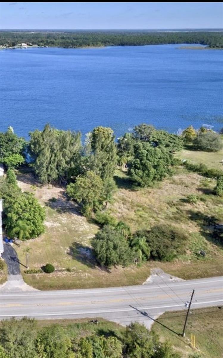 Large Beautiful Lakefront lot. Nearly 1/2 acre 78'x 284' Located on Red Beach Lake. Mature Mango trees on property.