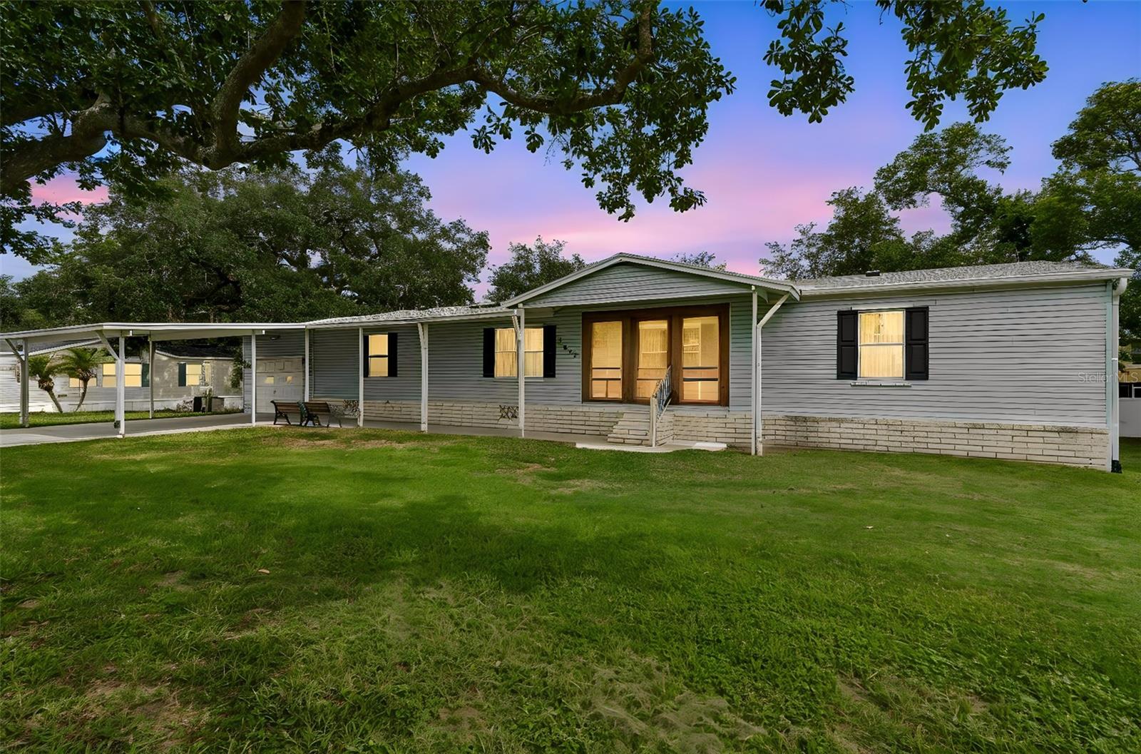 Rare Opportunity – Well-Maintained Palm Harbor Home on a Double Lot with No HOA!
Enjoy the freedom of owning both the land and the home with this beautifully maintained Palm Harbor manufactured home situated on an oversized 0.23-acre double lot. Offering 1,776 square feet of living space with 3 bedrooms and 2 bathrooms, this spacious home is thoughtfully designed with large walk-in closets in every bedroom, providing exceptional storage throughout.
Major updates include a brand-new roof installed in 2025, giving buyers added peace of mind. Lovingly maintained and move-in ready, this home offers the perfect combination of comfort, functionality, and flexibility.
Step outside and you'll find features that truly set this property apart. The impressive 658-square-foot detached garage includes storage space above, while the separate air-conditioned workshop behind the garage is perfect for hobbies, a home office, crafts, or additional workspace. A concrete driveway, covered parking, and inviting porch areas provide plenty of room for entertaining and everyday enjoyment.
With no HOA and no lot rent, you'll appreciate the freedom to enjoy your property without restrictive rules or monthly fees. The oversized double lot offers plenty of space for gardening, pets, outdoor activities, or parking your boat or RV.
Whether you're looking for a full-time residence or a seasonal retreat, this well-maintained Palm Harbor home delivers the space, storage, and independence that's becoming increasingly hard to find. If you've been searching for a property where you truly own your land and have room for all your toys and hobbies, this is the one you've been waiting for.