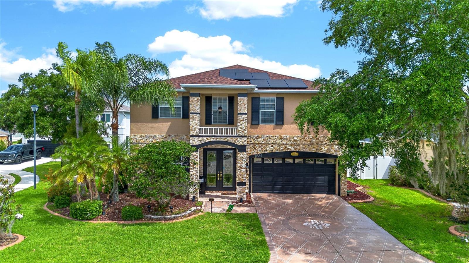 Welcome to 11384 Walden Loop in the highly desirable Kingsfield Lakes community of Parrish, Florida. This beautifully updated 4-bedroom, 3.5-bathroom pool home offers approximately 3,100 square feet of living space and combines modern upgrades, energy efficiency, and spacious living on a premium corner cul-de-sac homesite. The property features a recently installed custom stone exterior façade that provides exceptional curb appeal and a distinctive luxury appearance that sets it apart from neighboring homes.

One of the most valuable upgrades is the newly installed solar energy system, helping reduce utility costs while providing long-term energy savings and sustainability benefits. Inside, you'll find new flooring throughout the downstairs living areas, creating a fresh, modern feel and seamless flow throughout the main level. The home also features updated appliances, making the kitchen both functional and stylish for everyday living and entertaining.

Designed with space and flexibility in mind, this two-story residence offers multiple living and gathering areas, including a spacious family room, formal dining room, living room, and a large kitchen with ample cabinetry, generous counter space, and room for family meals. The open layout is perfect for hosting guests, holiday gatherings, or simply enjoying everyday life.

The expansive primary suite provides a private retreat with generous dimensions, a large en-suite bathroom, and plenty of closet space. Additional bedrooms are spacious and well-positioned, providing comfort and privacy for family members and guests alike. Crown molding, upgraded fixtures, and quality finishes throughout the home add character and sophistication.

Step outside to your private backyard oasis featuring a large screened and heated in-ground pool overlooking a peaceful natural preserve setting. Whether you're relaxing after work, entertaining friends, or enjoying Florida's year-round sunshine, this outdoor space offers the perfect environment. The second-story balcony and sun deck provide additional outdoor living space and beautiful views of the surrounding nature.

Kingsfield Lakes residents enjoy low HOA fees, community parks, playgrounds, walking areas, and an Olympic-style community pool. Conveniently located near I-75, US-301, Ellenton Premium Outlets, Lakewood Ranch, Bradenton, Sarasota, St. Petersburg, Tampa, top-rated schools, shopping, dining, medical facilities, golf courses, and Gulf Coast beaches, this home offers both convenience and lifestyle.

As an added benefit, the seller is including a 1-year home warranty for the buyer's peace of mind. With its custom stone upgrades, solar system, new flooring, updated appliances, private pool, preserve views, spacious floor plan, and prime Parrish location, this move-in ready home presents an exceptional opportunity for buyers seeking comfort, value, and Florida living at its finest.