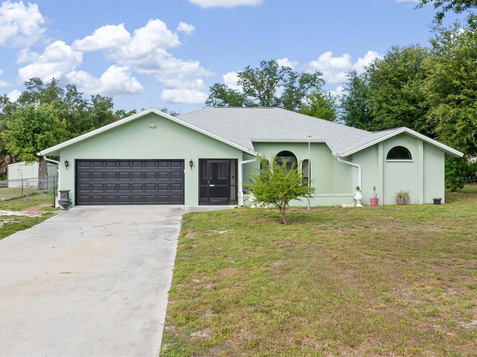 Beautiful Family Home. 2636 Sq Ft of Living Space on a Double TIP .82 acre Lot in East Englewood's Non-Deed Restricted Area! Beautiful Big Oak Trees on Property with A Fenced Area for Your Pets. Home features a beautiful gourmet Eat In kitchen with top-of-the-line appliances, gold accents, Large residential fridge, stainless steel range hood, double oven stove, and plenty of cabinet space and pantry for all your needs. This split floor plan has a large master bedroom and on suite, with walk in shower and separate soaking tub, his and her closets. Dining and living combo, a family room and bedrooms 2 and 3 on opposite side of the home with guest bath. Tile floors throughout, Plantation shutters on some of the windows, NEW hurricane impact windows and doors 2023, New roof 2022 30x40x14 garage 2022, electric added 2022, new garage door 2022 Ac 2019.  Large patio room of the rear of the home, leads outside to a paver patio for grilling and a tremendous Hurricane Impact Rated RV garage or as the previous owner used it for to repairs his many Harleys motorcycles, equipped with 2 large oversize doors one on each end and a side door for easy access. I newer hydraulic lift and plenty of excess storage room. in addition to this gem there is an additional storage shed for yard equipment and more.  Use Your Kayak or rowboat on the Butterford Waterway at the rear of the property. All Utilities from Street Are Underground! Home Is Not in a Flood Zone! Schedule your showing NOW!!