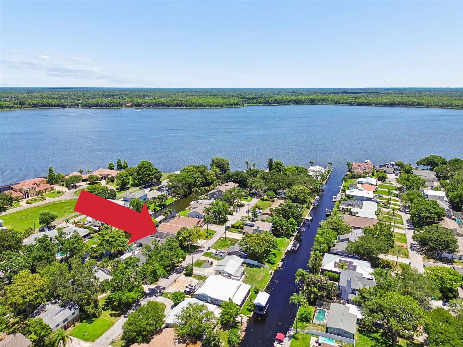 Virtually Staged. Welcome to your own slice of waterfront paradise on Lake Tarpon! This canal-front property offers the perfect combination of boating, recreation, and Florida living, with direct access to one of Tampa Bay's most sought-after waterfront destinations.
Located just minutes from beautiful Lake Tarpon, this waterfront home is ideal for boating enthusiasts, anglers, and anyone who loves an active outdoor lifestyle. Enjoy easy access to boating, water skiing, wakeboarding, tubing, fishing, and sunset cruises right from your backyard. The property features a private boat dock, making it easy to get out on the water whenever the mood strikes.
Major updates include a NEW ROOF (2024). Outside, you'll find a large screened enclosure, complete with a caged lap pool and spillover spa, creating the perfect setting for entertaining, relaxing, or enjoying the Florida sunshine year-round.
The flexible floor plan offers excellent options for today's lifestyle needs. A spacious downstairs bonus room with a private bath is ideal for a home office, media room, game room, guest suite, or multigenerational living arrangement.
Upstairs, the main living area is filled with natural light and architectural charm. The expansive great room features vaulted ceilings, skylights, and a fireplace, creating a warm and inviting gathering space. Step onto the second-floor balcony and enjoy tranquil water views. The main living area offers three bedrooms and two baths, including a private primary suite with an en-suite bath and jetted tub.
Whether you're looking for a waterfront pool home, a canal-front property with boat access, a home with direct lake access, or a place to enjoy the ultimate Tampa Bay boating community lifestyle, this property delivers. Conveniently located near Gulf beaches, shopping, dining, entertainment, top-rated amenities, and Tampa International Airport, you'll enjoy the perfect balance of waterfront living and everyday convenience.
Bring your boat, your fishing gear, and your sense of adventure—this Lake Tarpon waterfront home is ready for you to start making memories.