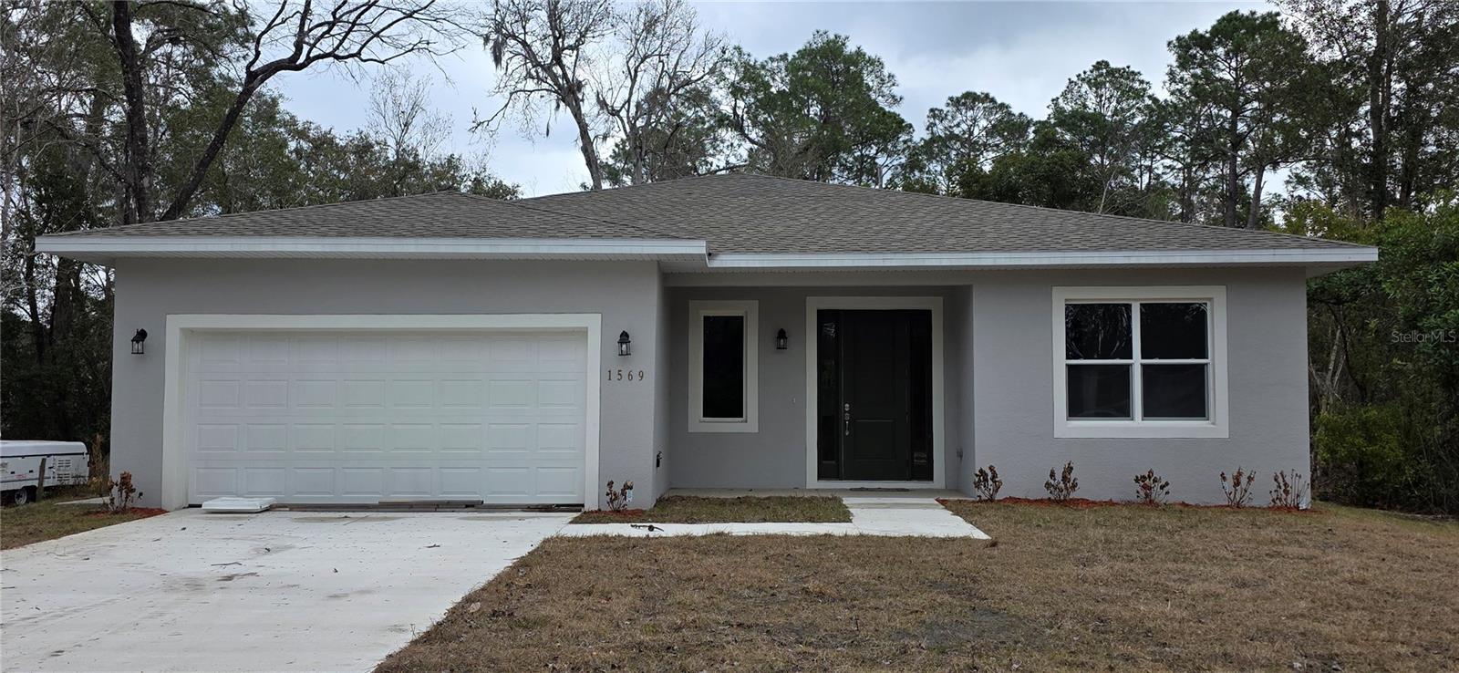MULTI-GEN SUITE HOME. New Construction. NO HOA. Spacious 4-bedroom, 2-bath single-family Home featuring a versatile attached IN-LAW suite with a private entrance! Whether  you are looking for a multigenerational living arrangement, a private guest space, or an opportunity for supplemental rental income, this flexible layout offers endless possibilities. The main Home provides generous areas, comfortable bedrooms, and a functional floorplan while the attached efficiency includes its own living/sleeping area, bathroom, and kitchenette. The covered lanai and big backyard allows for endless possibilities to create you own oasis. Come see it for yourself.
