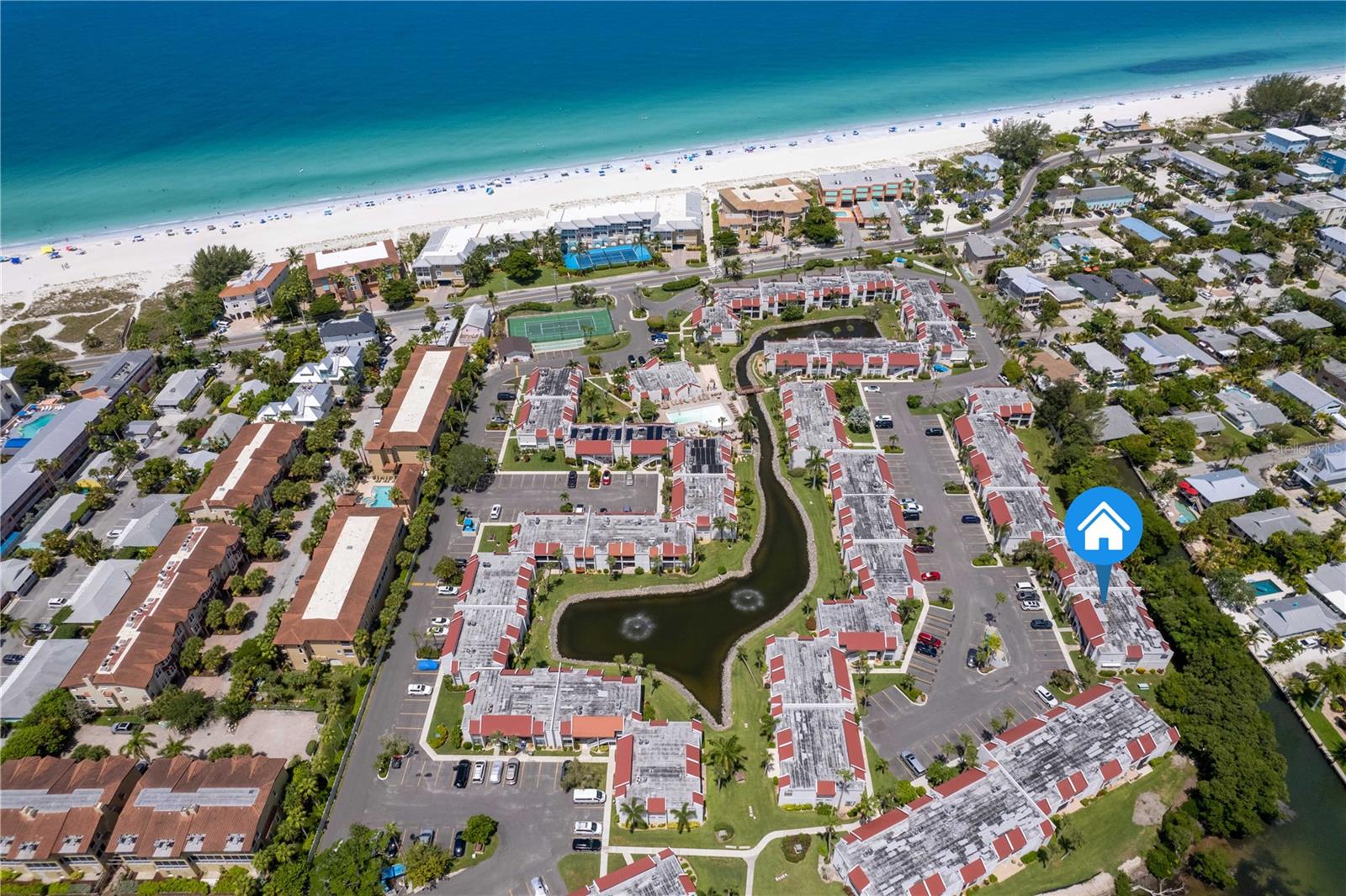 Turnkey coastal living awaits in this fully renovated 2-bedroom, 2-bathroom condo nestled within the sought-after Runaway Bay community on Bradenton Beach. Whether you're looking for a primary residence, second home, or investment property, this move-in ready unit checks every box.
The primary suite features a king-size bed configuration and a private ensuite with a spacious walk-in shower. The second bedroom offers flexible sleeping arrangements with twin beds and convenient access to the hallway bath, which includes a shower/tub combination. Both bedrooms are bright, well-appointed, and freshly updated.

A complete top-to-bottom renovation sets this unit apart — new LVP  flooring in bedrooms, fresh paint, stylish finishes, and a fully remodelled kitchen with stainless steel appliances. The private patio provides a peaceful outdoor retreat with serene surroundings.

Runaway Bay residents enjoy private beach access just steps away, leading to miles of pristine white sand along the Gulf of Mexico. Community amenities include a heated pool, fitness center, and tennis/pickleball courts.