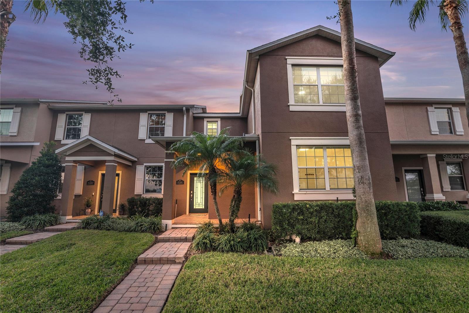 Welcome to Signature Lakes – Independence, one of Winter Garden’s most desirable communities. This beautifully maintained 4-bedroom, 2.5-bath townhome offers a bright open layout with modern finishes, including white cabinetry, granite countertops, stainless steel appliances, designer pendant lighting, and a spacious breakfast bar overlooking the large living area. A delightful feature of this home is the private, fully screened paver courtyard, perfect for relaxing or entertaining, with direct access to the two-car garage. The Primary Bedroom is conveniently located on the lower level. Upstairs you’ll find 3 additional bedrooms and a loft area that could be used for an office space or secondary living room. Residents of Independence enjoy resort-style amenities including two clubhouses, community pool, fitness center, tennis and basketball courts, playground, dog park, business center, walking and biking trails, and a community boat ramp with access to Lake Hancock and Lake Speer. Internet, cable, and lawn care are included with the HOA. Ideally located near Hamlin, Horizon West, top-rated schools, major highways, shopping, dining, and Disney attractions, this home offers the perfect blend of comfort, lifestyle, and convenience.