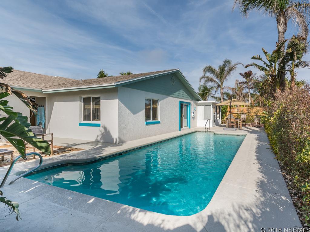 Immaculate 2 bedroom, 2 bath, pool home just a short walk to the no drive beach.  2 master suites plus Murphey bed in living room and large enclosed patio with its own air conditioner, which sellers use as a bedroom for guest.  Enjoy outdoor fun in your heated, salt water pool with plenty of entertaining space. Pool and pool equipment all recently updatedLarge open family room with dining area overlooks the lush pool grounds. No maintenance yard.Need a place for your toys? The fenced yard has enclosed boat parking. Tandem garage allows work space or space for kayaks,surf boards, paddle boards and fishing gear. This house is in mint condition with quality furnishings.Art, some furniture, Knick knacks and personal items not included but some may be negotiable. Enjoy all this home has to offer while being just a short walk or bike ride to the no drive beach. ;Water: City