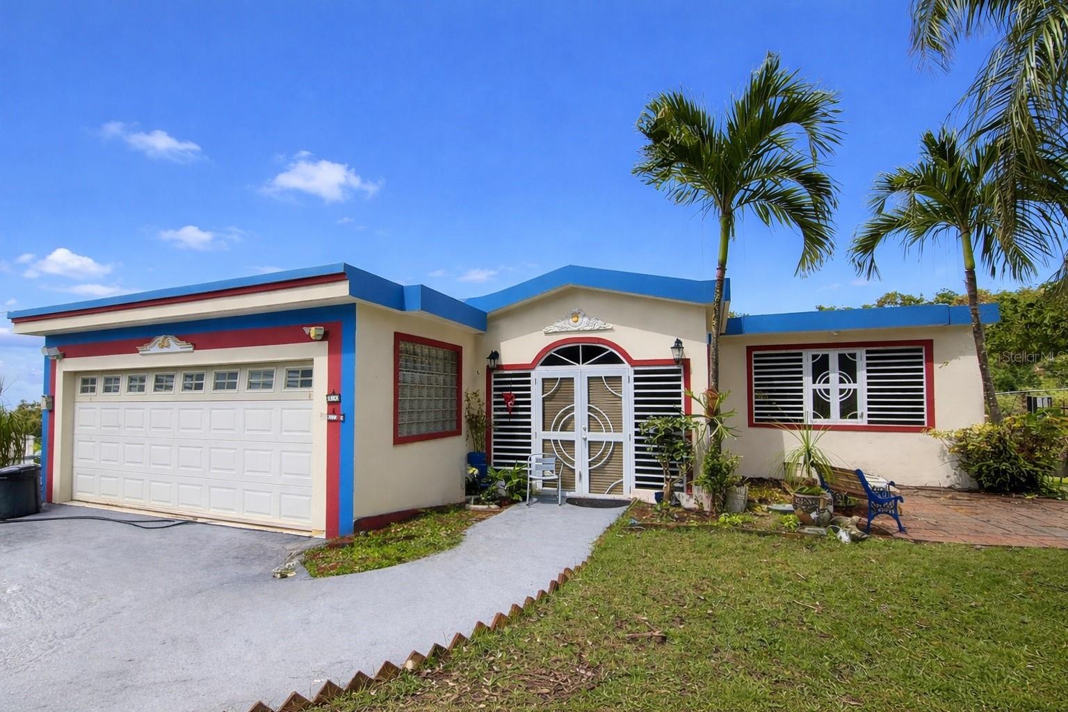 Located in Buena Vista Ward. Spacious move-in ready residence in the Bayamón countryside. It has 2 levels distributed in 3 bedrooms, 2 bathrooms, living room, dining room, kitchen and, on the ground floor, study-office with a full bathroom. 2-car carport and additional parking space in the frontyard. Structure of 3,400 sf approx. of construction, on a .98 acres lot. Beautiful mountain views. It has an electric gate that gives access to the main entrance of the property and an independent side entrance with direct access to the study-office. Quiet community in the Buena Vista Ward, Algarrobo Road, 9.2 miles from the University of Puerto Rico-Bayamón Campus, and 5 miles from the Monte Frío Recreational Area, among others. FEMA: X (Low or moderate flood risk). Rating: R-G (Rural General). Annual Property Taxes: $1,665.87 approx. (without exemption; exonerated at the moment with payment of $228.86 annually). Property is sold as is.