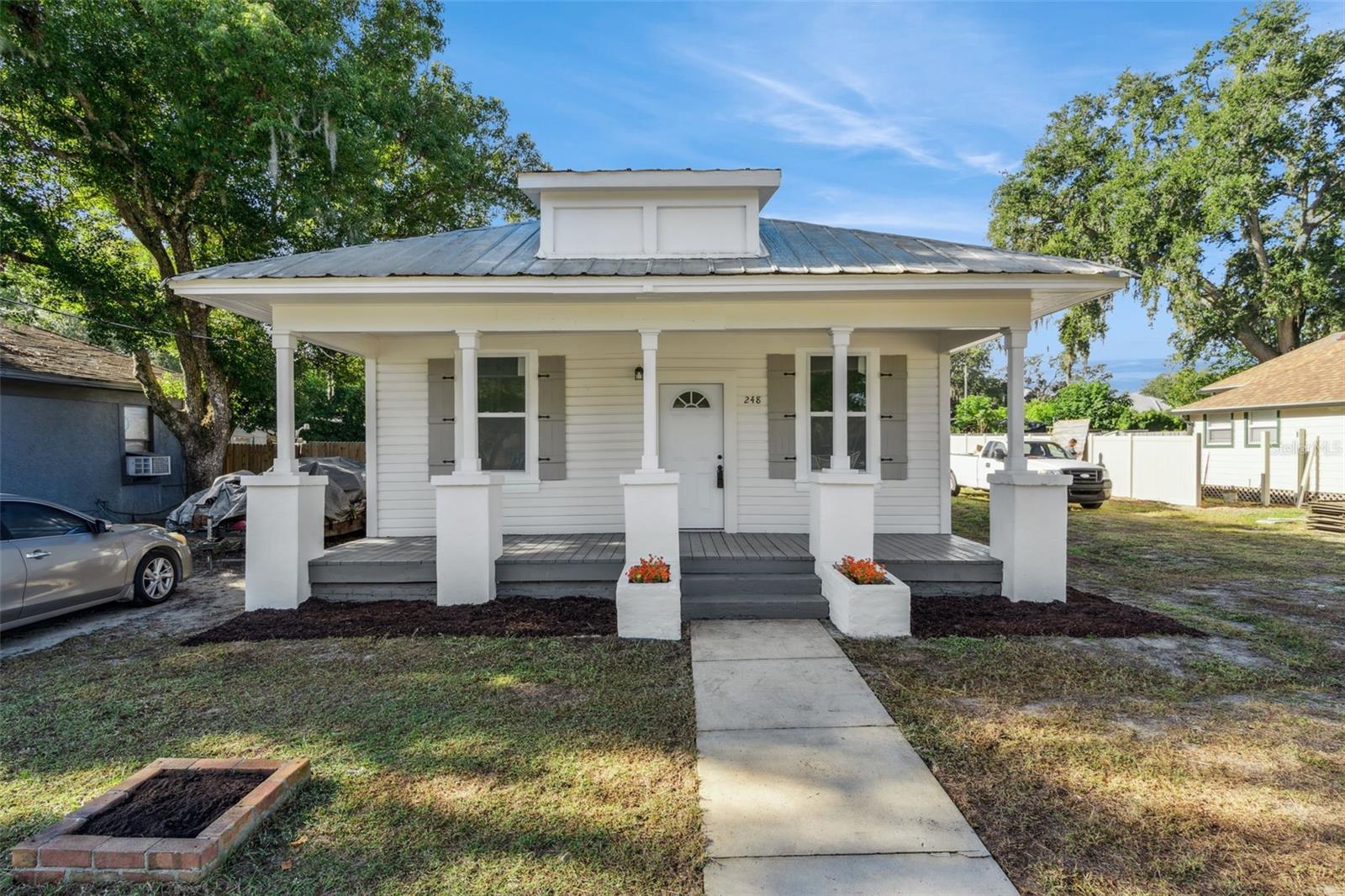 Completely renovated from top to bottom, this charming 3-bedroom, 1-bath home blends modern updates with the timeless character of a classic Florida home. Conveniently located just off State Road 50, you'll enjoy quick access to shopping, restaurants, entertainment, and everything Groveland and nearby Clermont have to offer. Nearly every major component has been updated, giving you the confidence of a move-in-ready home. Recent improvements include new windows, electrical, plumbing, flooring, cabinetry, countertops, HVAC system, hot water heater, and fresh interior paint throughout. Inside, you'll find a bright, open-concept layout designed for comfortable everyday living and effortless entertaining. The beautifully updated kitchen flows seamlessly into the living space, while neutral finishes and stylish fixtures create a warm, inviting feel that's both modern and timeless. Step outside to a generously sized yard with plenty of room to make it your own—whether you envision a garden, outdoor entertaining space, play area, or future additions. With no HOA, you'll have the freedom and flexibility that's becoming harder to find. Whether you're searching for your first home, your next investment property, or simply a turnkey home in a fantastic location, this one is ready to impress. Schedule your private showing today and discover why so many buyers are choosing to call Groveland home.
