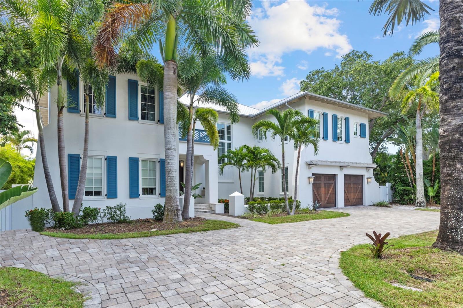 THE ONLY HOME FOR SALE ON COVETED PIRATE'S COVE! Stunning Dutch West Indies style w/Contemporary touches in the heart of Westshore/ South Tampa located on 1/4 acre on protected Pirate's Cove minutes from open water. Architecturally designed by Cooper, Johnson, & Smith - Built by Loupin Construction - Interiors by Rob Bowen Design. This Light & Airy home has been well planned out w/4 en-suite bedrooms each w/outfitted walk-in closets, an office w/custom built ins PLUS an Expansive 900 sqft 1st floor bonus space to emulate a pool cabana w/onyx bar flanked by 3 sets of double doors leading out to the covered lanai - w/ outdoor kitchen & outside shower overlooking the new composite deck, heated pool, & natural gas sunken fire pit w/ hidden pop-up TV. LED color changing lighting, salt-system pool chlorinator & included chaise lounge chairs overlooking the deep-water secluded Pirate's Cove with quick access to the bay & dock ready for boat lift. Sweeping waterfront views from the second floor open concept great room/dining/kitchen w/peaked cypress clad ceiling leading out to a 43' covered balcony. Master retreat w/sitting room, double closets, & a breathtaking spa inspired bathroom. Well equipped Kitchen; Subzero/Wolf appliances, gas range, CONCRETE counters w/waterfall edge & custom cabinetry. Superior construction; 2 story block, spray foam insulation, Weathershield Impact windows/doors, extensive insulation, solid core interior doors, a metal roof, Bitwise Home Automation system and ELEVATOR. Elegant interior finishes; Duchateau oil rubbed oak flooring, Spanish encaustic tiles, 7" crown throughout, stone feature wall in great room, cable railing and an array of unique porcelain tiles throughout the home's 6 bathrooms. Truly custom unique floorplan with one-of-a-kind touches. Waterfront living at it's finest. DON'T MISS the attached video & matterport walk through