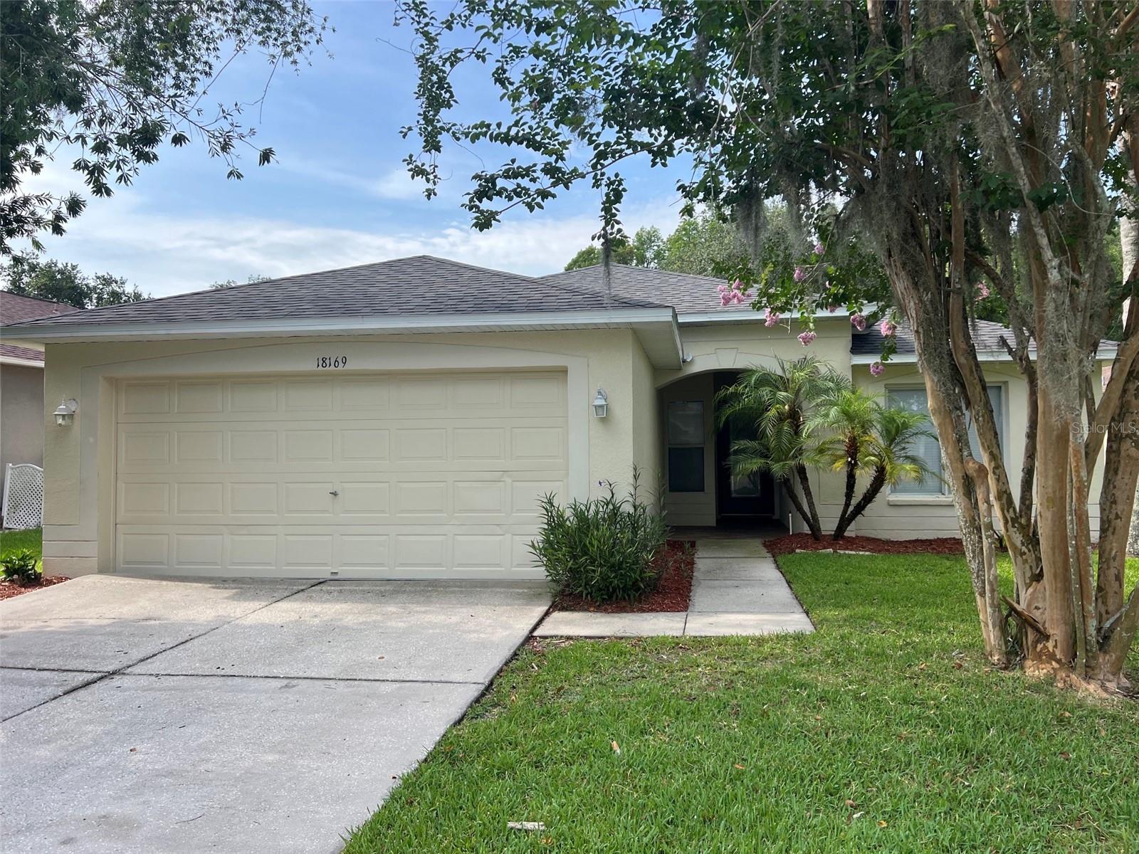 Welcome to 18169 Sandy Pointe Dr in Tampa, a well-maintained 4-bedroom, 2-bathroom home offering comfortable living in a desirable location. The open layout provides a bright and functional flow between the living, dining, and kitchen areas, ideal for both everyday living and entertaining. The nicely updated kitchen features ample cabinetry and workspace. The primary suite includes a private bath and generous closet space, while the additional bedrooms offer flexibility for family, guests, or a home office. Enjoy outdoor living in the white fenced backyard, perfect for privacy, pets, and gatherings. Conveniently located near shopping, dining, major highways, schools, and local amenities, this home blends comfort and convenience in one attractive package. Don?t miss the opportunity to make this Tampa property your next home.  Roof is 2024, and the fence is 2025.
