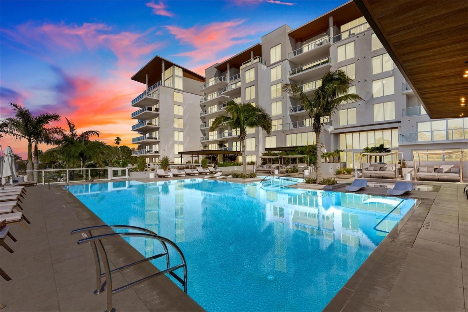 Welcome to Serena by the Sea, where luxury coastal living meets panoramic Intracoastal water views in the heart of Clearwater. This beautifully appointed 3-bedroom, 3.5-bath residence offers 1,884 heated square feet of refined living space with high ceilings, floor-to-ceiling windows, an open-concept layout, and a private balcony designed to capture stunning sunset views.

The modern kitchen features premium appliances, stone counters, solid surface finishes, built-in features, and a seamless connection to the main living area, creating an ideal setting for everyday living and entertaining. The spacious primary suite offers a walk-in closet and a spa-inspired bath with dual sinks and a walk-in shower, while two additional bedrooms provide comfort and privacy for guests or family.

Serena by the Sea offers a boutique waterfront lifestyle with resort-style amenities including a community pool, fitness center, clubhouse, gated entry, security, and beautifully maintained common areas. The residence also includes assigned under-building parking, electric vehicle charging access, and a private storage unit.

Perfectly positioned near Downtown Dunedin, Clearwater Beach, restaurants, shopping, parks, and waterfront attractions, this residence combines modern construction, low-maintenance condo living, and an exceptional Gulf Coast location. Schedule your private showing today.