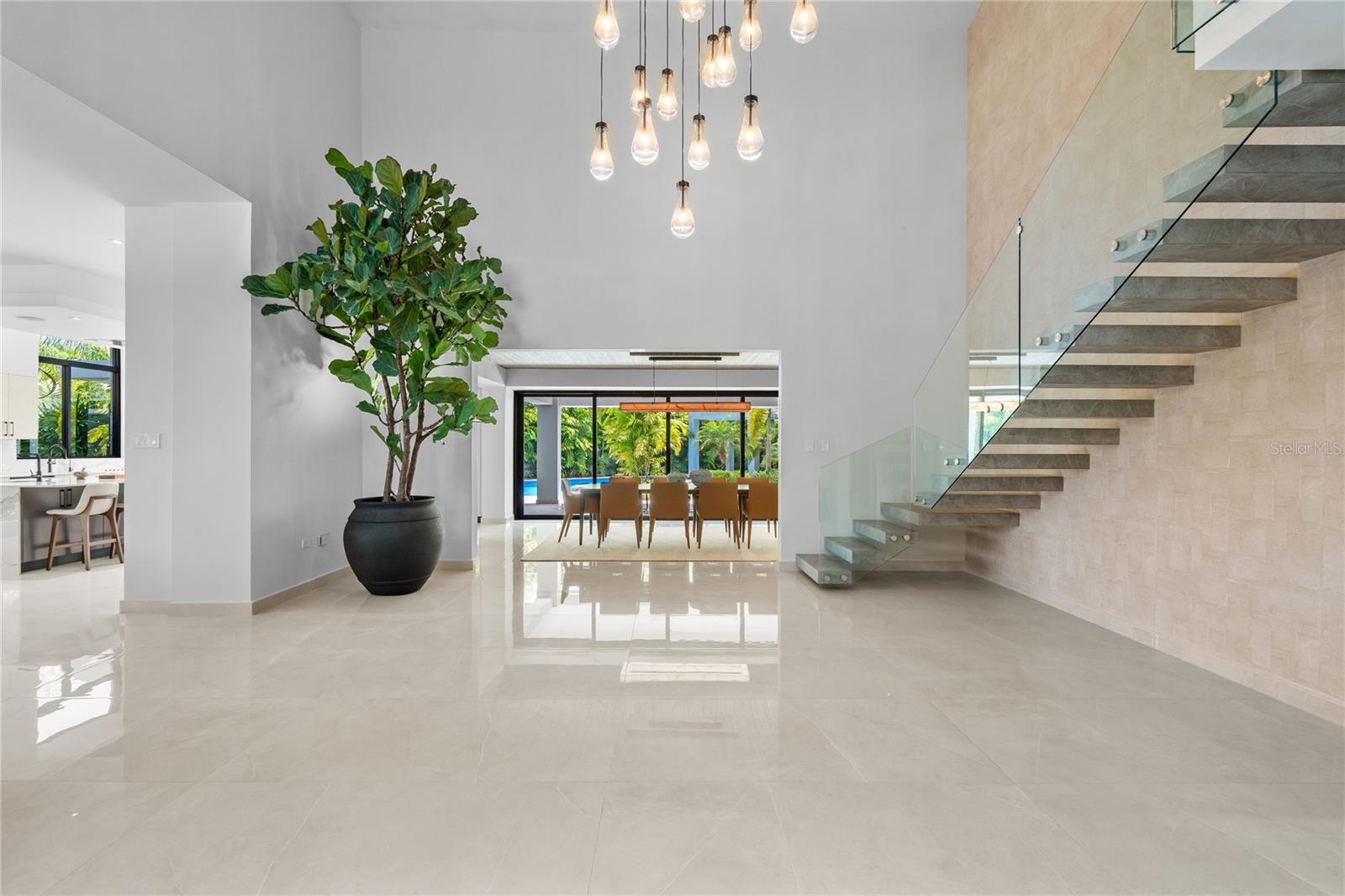 A rare opportunity to own a true entertainer’s estate, where seamless indoor-outdoor living, modern design, and resort-style amenities come together in one of Dorado Beach East’s only fully new construction offerings.
Welcome to a truly exceptional residence, where thoughtful design and modern elegance create a private resort-style experience within Dorado Beach East. This is not just another home in the community, this is a rare, fully reimagined offering, unlike anything else currently available.
Designed with entertaining at its core, the home’s expansive living areas flow effortlessly into a spectacular covered terrace, creating a natural connection between interior and exterior spaces. Floor-to-ceiling glass walls and doors flood the interiors with natural light while framing the home’s lush, beautifully landscaped grounds, allowing you to enjoy the outdoors from every space inside.
The outdoor experience is nothing short of extraordinary, featuring covered terraces, a lap pool with hot tub, outdoor kitchen, and full bathroom, perfectly designed for hosting unforgettable gatherings or enjoying relaxed resort-style living at home. 
Inside, the home continues to impress with a stunning 1,500 sq ft game and TV room with kitchenette, truly a dream space and an incredible entertainment hub for all ages. 
Designed to comfortably accommodate large or multi-generational families, the home offers an expansive and thoughtfully laid-out floor plan with 7 bedrooms (4 upstairs, 3 downstairs) and 7 full + 1 half bathrooms, including a luxurious primary suite with dual walk-in closets, private terrace, and a spa-style bathroom featuring both indoor and outdoor showers. 
Complementing the main residence is a fully equipped 2-bedroom, 2-bathroom guesthouse with its own kitchen and laundry, perfect for hosting extended family or guests in complete privacy. 
At the heart of the home, a beautifully designed Euro-style kitchen with double refrigerators and dishwashers, expansive island, and pantry flows effortlessly into the family room and terrace, ideal for both everyday living and entertaining on a grand scale. 
Further elevating the home’s functionality and long-term value is a state-of-the-art infrastructure, including 99 solar panels with a 193 kWh battery system, diesel generator, and independent transformer, offering efficiency, sustainability, and true energy independence. 
With approximately 9,312 sq ft of interior living space, 12,215 sq ft total construction, and set on a 1,700 m² lot, this fully furnished, turnkey residence delivers scale, design, and functionality rarely found in today’s market. 
This is truly a “resort within the resort”, a home designed for entertaining, built for family living, and distinguished by the rare advantage of being completely new construction in an established, highly sought-after community.
