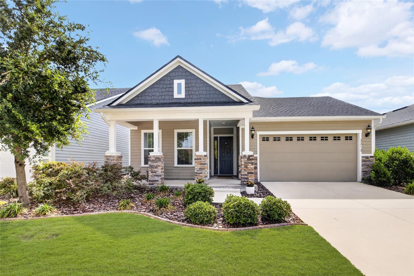 One or more photo(s) has been virtually staged. Welcome to The Charlotte, an elegant cottage-inspired residence in the highly sought-after Oakmont community. Blending timeless architectural appeal with modern design, this beautifully crafted home offers 3 bedrooms plus an oversized office/flex space featuring stunning double glass doors—perfect for a private workspace, library, or additional living area.

Inside, soaring 12-foot ceilings and a thoughtfully designed open-concept layout create a light-filled atmosphere ideal for both everyday living and entertaining. The chef's kitchen seamlessly connects to the spacious living and dining areas, while a convenient mudroom entry and oversized walk-in pantry add functionality and style.

Privately tucked away, the owner's suite serves as a luxurious retreat, complete with a spa-inspired bath featuring a soaking tub, walk-in shower, and generous walk-in closet.

Step outside to an oversized backyard designed for relaxation and entertaining. The garage has been recently upgraded with premium Shark Coating flooring, offering both durability and a polished finish.

Residents of Oakmont enjoy resort-style amenities including a clubhouse, fitness center, resort pool, tennis courts, and scenic walking trails. Conveniently located just minutes from Celebration Pointe, Butler Plaza, the University of Florida, and UF Health Shands Hospital, this exceptional home offers the perfect blend of luxury, comfort, and location.