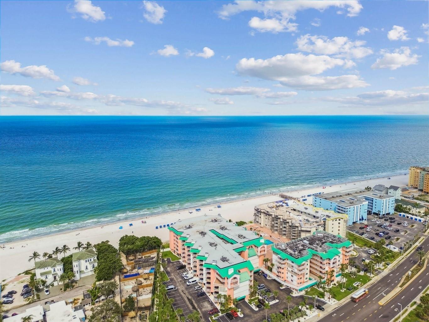 Turnkey. Ready to earn from day one. Unit 1301 at Beach Cottage is a 1,400 square foot, fully furnished two-bedroom, two-bath Gulf-front condo with superb reviews and weekly rentals allowed. Step onto your oversized private balcony and enjoy south westerly tropical views and partial views of the Gulf. The beach and resort style pool are just below. White sand. Warm water. Endless sunsets over Indian Shores. Inside, the space is clean, open, and filled with light. The living and dining rooms flow to the wide beachfront balcony. A fireplace adds warmth and character. The kitchen offers ample cabinet space, generous counters, and a breakfast nook built for slow mornings after the beach. Full size laundry is also located in the kitchen. The split-bedroom layout gives owners and guests privacy. The primary suite faces south west and opens to the balcony. It features a walk-in closet and dual vanities. The second bedroom and bath are spacious and comfortable for family and guests alike. Beach Cottage offers resort-style amenities including a heated pool, hot tub, expansive sun deck, grilling station, elevator access, under-building assigned parking, guest parking, and bike and kayak storage. Walk to local restaurants, beach bars, boutiques, fishing charters, and live music. Paddleboard at sunrise. Take the trolley down the coast. Two international airports are within easy reach. A second home. A full-time residence. An investment with real income and real views. This is Gulf living, simple and true