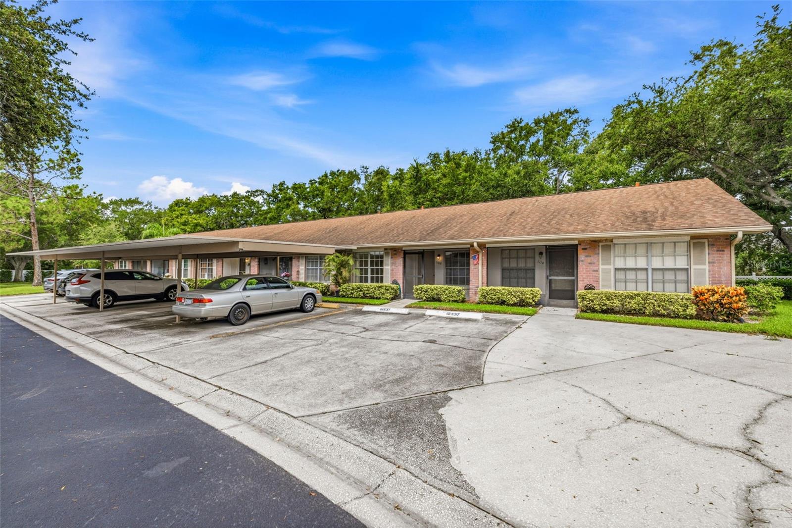 Welcome to Scotsdale Villas, a desirable 55+ community nestled in the heart of Dunedin, offering low-maintenance living and an unbeatable coastal location. Known for its laid-back lifestyle and small-town charm, Dunedin offers locally owned restaurants, waterfront dining, craft breweries, boutiques, art galleries, and year-round festivals and community events. Historic Downtown Dunedin, the Toronto Blue Jays spring training stadium, Dunedin Community Center, shopping, grocery stores, medical facilities, and everyday conveniences are all just minutes away. Outdoor enthusiasts will love being close to the Pinellas Trail for biking and walking, along with nearby parks, golf courses, and scenic waterfront areas. The Dunedin Causeway provides a direct route to Honeymoon Island State Park, where you can spend the day swimming, kayaking, fishing, or watching breathtaking Gulf Coast sunsets. This charming single-story villa offers 2 bedrooms and 2 bathrooms of thoughtfully designed living space. An assigned carport is located just steps from the front door, with nearby guest parking available. Stepping inside, the open-concept floorplan features a comfortable living area and a functional kitchen with a peninsula offering cabinetry on both sides for additional storage. The owner’s suite includes a private ensuite bathroom, a spacious closet, and An enclosed porch at rear and a screened porch at the front of the villa provide multiple places to relax and enjoy the beautiful Florida weather. The rear porch also includes a storage closet for added convenience. Enjoy a low-maintenance lifestyle with no flood insurance required. The HOA fee includes cable TV, internet, water, sewer, trash, exterior and grounds maintenance, and access to the community amenities. Residents enjoy two community pools, a clubhouse, tennis and pickleball courts, and shuffleboard. Scotsdale Park is also nearby, featuring walking trails, a scenic lake, playground, and pavilion. Whether you are searching for a full-time residence or an easy Florida retreat, this villa offers a wonderful opportunity to enjoy everything that makes Dunedin one of Tampa Bay’s most sought-after coastal communities. Schedule your showing today!