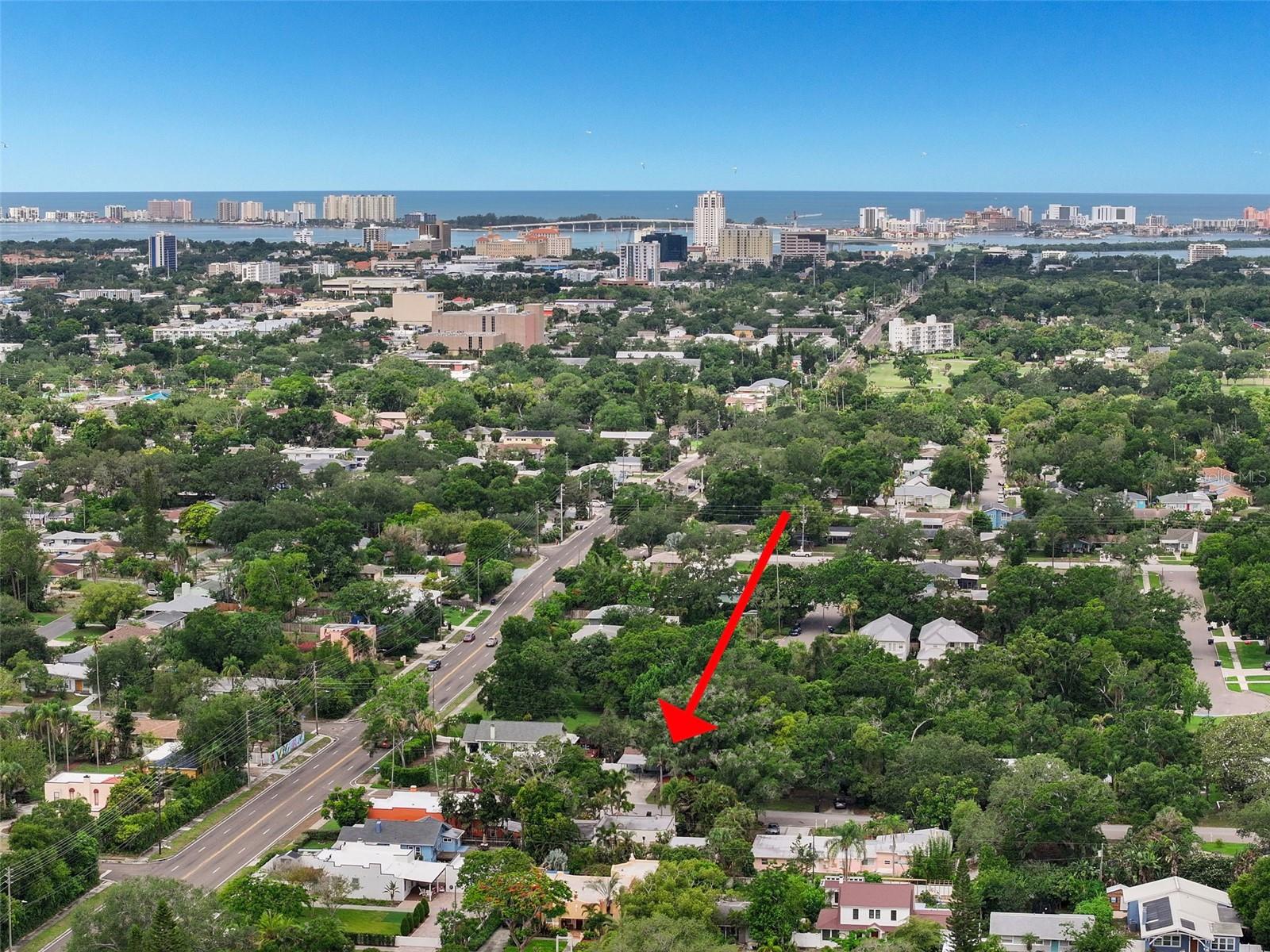 Your opportunity to be in the heart of the historic Glenwood Estates!! 3BR + bonus, 3BA, beautifully updated home offers the perfect blend of character and modern convenience—just two miles from downtown Clearwater and a quick 15-minute drive to the sugar sands of Clearwater Beach. Step through the new front door into an open floor plan anchored by a spacious great room and kitchen combo, featuring luxury vinyl flooring, soaring cathedral ceilings, and a cozy wood-burning fireplace. The eat-in kitchen has been completely renovated with crisp white shaker cabinets, elegant quartz countertops, and new stainless steel appliances—a true chef's delight. A convenient inside utility area with washer and dryer sits just off the kitchen. Sliders off the great room lead to a screened-in deck overlooking peaceful green space behind the home—perfect for morning coffee or evening relaxation. On the main floor, you'll find the primary suite along with a guest bedroom. The primary bath has been fully renovated with a double vanity and walk-in shower, and the guest bathroom has also been beautifully updated. A spiral staircase in the great room leads down to a versatile lower level featuring a large bonus room—ideal as an office, second living room, or playroom—plus an additional bedroom and a fully renovated bathroom, all finished with ceramic tile flooring. A generously sized storage room off the bonus area adds even more flexibility and offers tons of extra storage space. Both the bonus room and downstairs bedroom offer direct access to a rear patio with lovely views of the backyard and green space beyond. Roof 2023 and A/C 2018. This one-of-a-kind, multi-level layout offers space, style, and privacy in one of Clearwater's most sought-after historic neighborhoods. Close to everything including Crestlake Park, Baycare Sound at Coachmen Park, Pinellas Trail, great restaurants, shopping, hospitals, and two international airports. Don't miss your chance to make it yours!