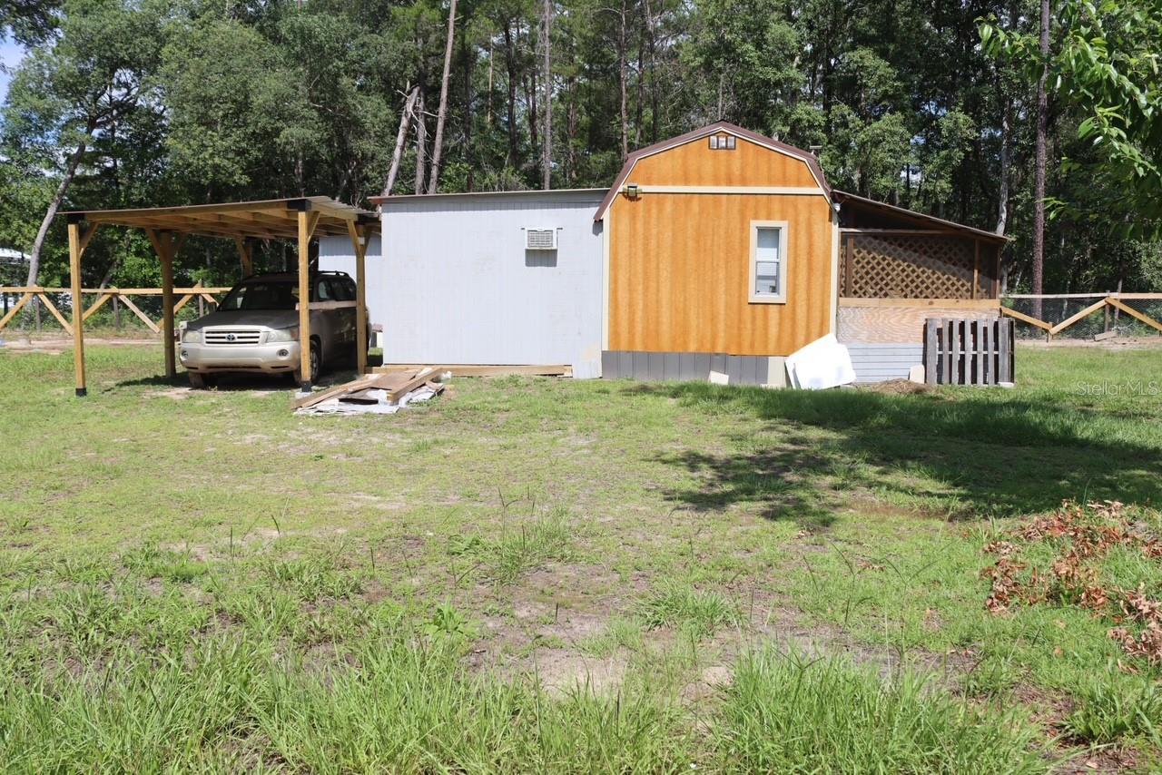 Nestled in a charming community in Interlachen FL, often described as the peaceful place "between the lakes." This property offers the perfect opportunity to enjoy a slower pace of life surrounded by nature's beauty. Known for its excellent fishing, abundant wildlife and quiet atmosphere, this area is a hidden gem for those seeking tranquility and outdoor enjoyment. This cozy one-bedroom, one bathroom home is  full of potentials for its next owner. The spacious yard provides plenty of room for gardening, hobbies, outdoor entertaining or future home projects, allowing you to make the property your own. Adding to its versatility is a separate detached room that has previously been used as a bedroom. This flexible space could easily serve as a home office, craft room, workshop, guest space or additional storage depending on your needs. An outdoor bathroom is currently in the process of being added and once completed, could provide even greater functionality and convenience to the property. Whether you're looking for a peaceful weekend retreat, a fishing getaway, an investment opportunity, or a place to create your own vision, this property offers endless possibilities in a welcoming lakeside community. Come experience the quiet charm and natural beauty that makes life between the lakes so special.