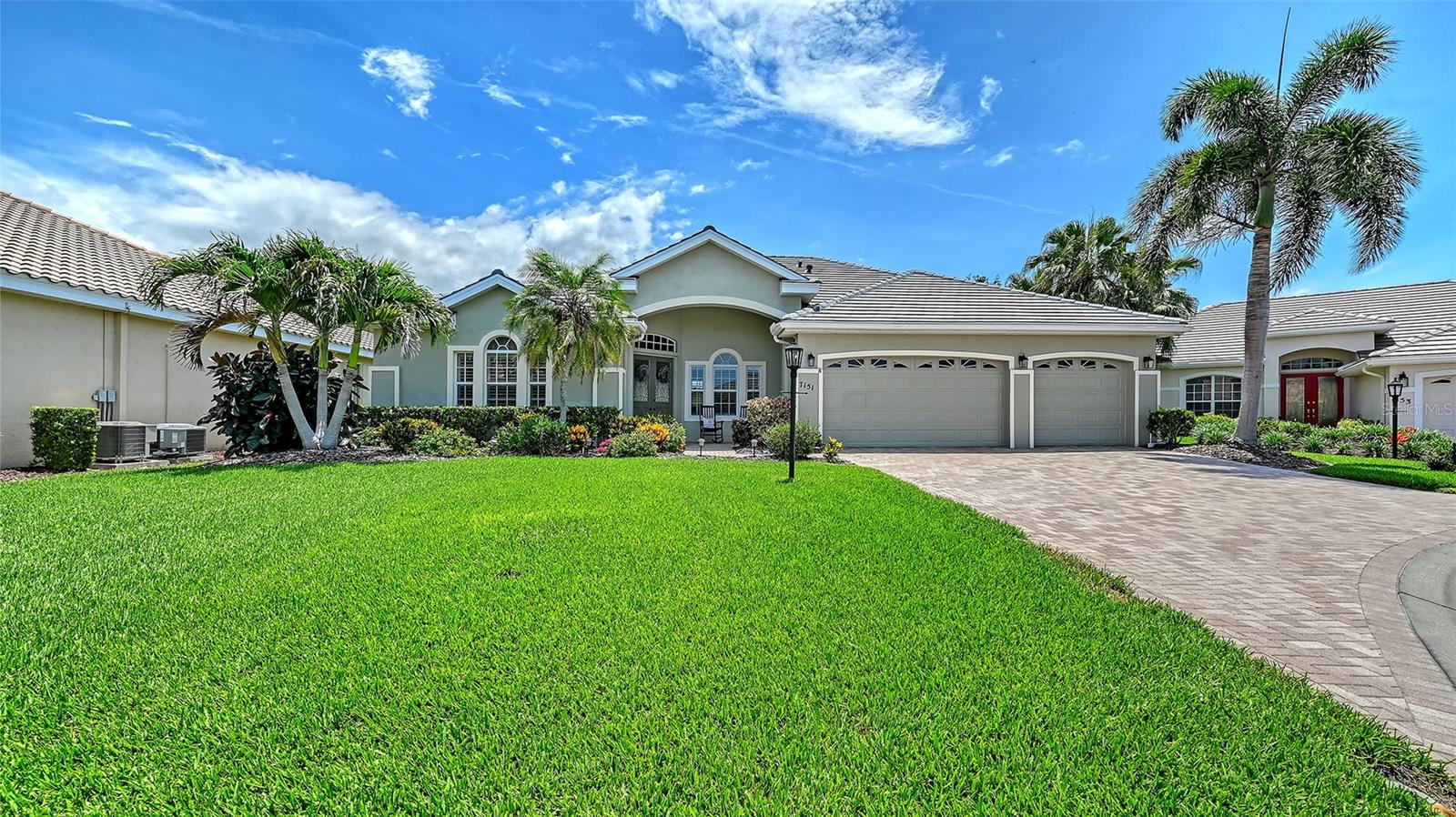 Welcome to West Hampton, a quiet gated enclave of just 57 high quality residences in popular Palmer Ranch. This beautifully updated 4 bedroom plus den/office, 3 bath home is located on one of the most desirable waterfront cul-de-sac lots in the community, with a panoramic view of nature from the pool and lanai, as well as from the interior living space.The features and upgrades in this home will allow you to check off  nearly everything on your “must have” list. The new flat tile roof (2025) is just one of many items that make this home “better than new.” As you enter, you will immediately recognize the classic split floor plan, with the den to your left and the living and dining rooms ahead and to your right. Take note of the beautiful ceramic plank floors which run throughout the home, then look ahead to  the view of the pool and spa, and the pond  beyond. The owners have creatively reimagined this space, providing a formal dining area that takes full advantage of the view. The primary suite is to your left, where you will find  an updated en suite bathroom with separate sinks, a dressing table, tub and walk-in shower. The bedroom features a walk in closet and a second large closet, and of course, a view of the pool and pond and access to the lanai. Pass through the center of the home to the combined kitchen/family room, where you will still enjoy the full view of the pool and lanai. The kitchen will satisfy the needs and desires of those who love to cook, with plenty of cabinet space, a new double wall oven (with convection), oversized LG refrigerator, and Wolf gas cook top. A built-in desk and china cabinet are located in the adjoining dinette. Beyond the family room to the rear of the home you will find a 14'x19' guest suite which provides an en suite bathroom, access to the pool, and a picture window overlooking the pond. Two additional bedrooms, a bathroom, the laundry and pantry complete this side of the home. Returning to your “must have” list, you can check off the 3 car garage, two newer HVAC units, natural gas for heating and cooking, brick driveway and lanai, ideal location near beaches, shopping, dining, the city of Sarasota, and more. If good schools are on your list, excellent private and public schools are nearby. Please note that all furniture is available for purchase at buyer's option under separate agreement.