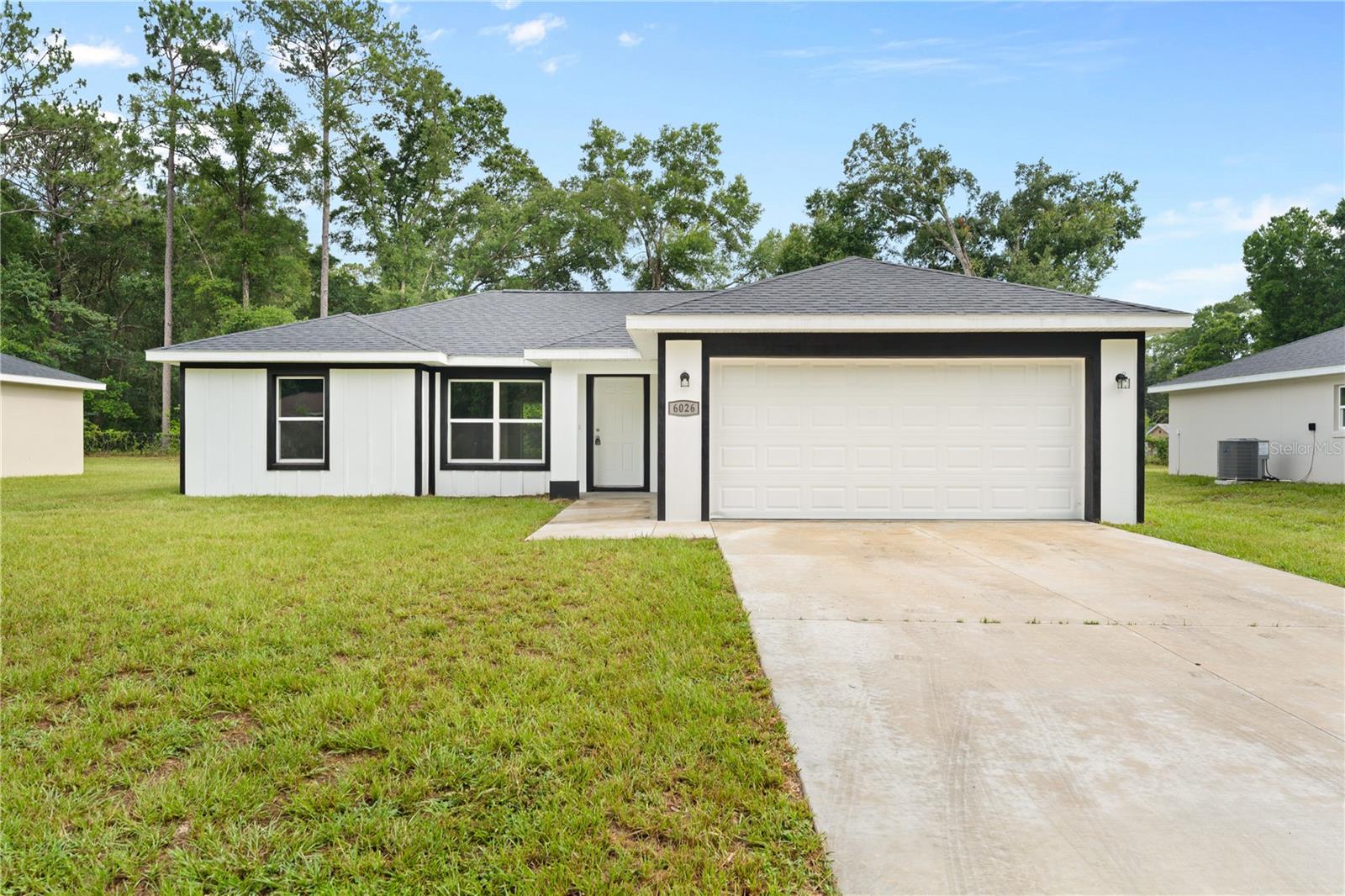 Beautiful new 3-bedroom, 2-bath home .24 lot with no HOA! This thoughtfully designed home features high ceilings, oversized baseboards, wood window sills, quartz countertops, stainless steel appliances, a large center island with seating, pantry, and self-closing cabinets and drawers. The spacious primary suite offers a tray ceiling, large walk-in closet, dual vanities, and a stunning floor-to-ceiling tiled walk-in shower. Buyers will appreciate the upgraded fixtures, hidden TV wiring locations in the living room and primary bedroom, two-car garage with opener, well and septic, and open patio. Quality craftsmanship and attention to detail are evident throughout this move-in-ready home.